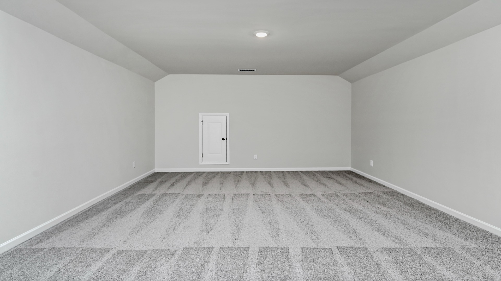 Upstairs finished loft space with carpet flooring