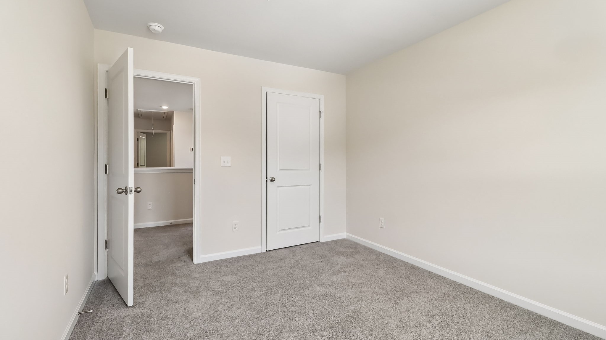 Private closet and carpet flooring in bedroom 2