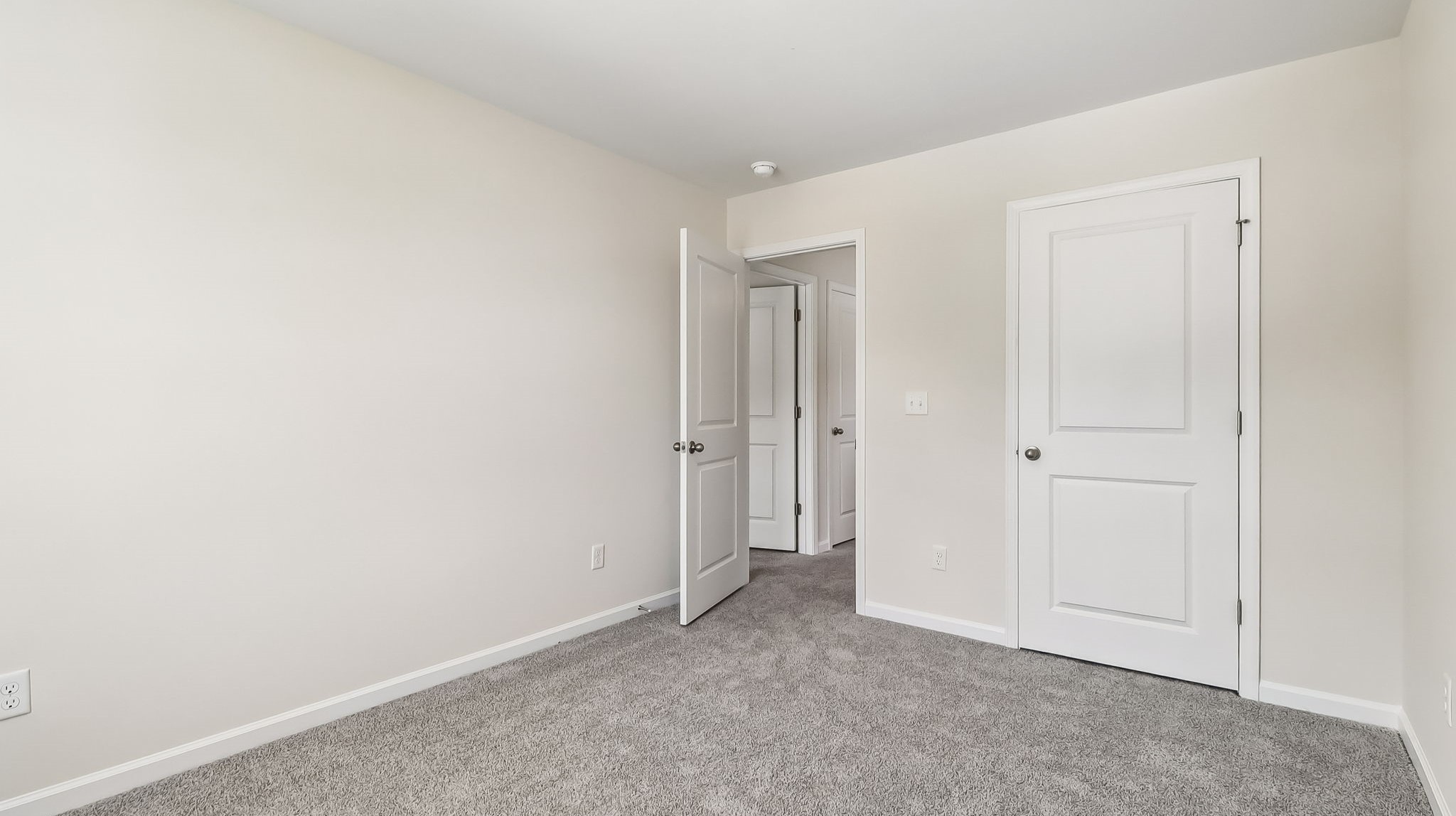 New home for sale with carpet in the bedrooms and private closets