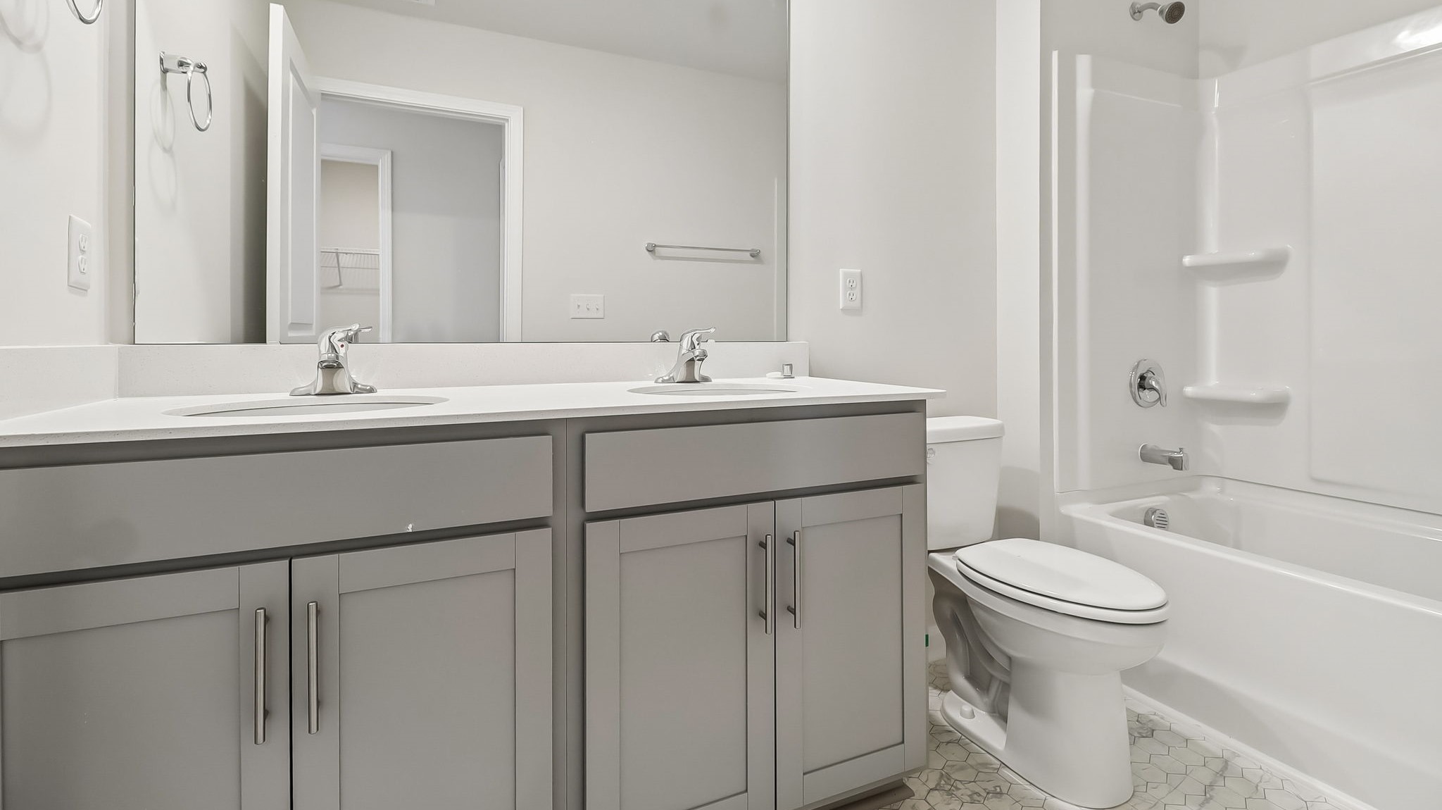 Bathroom 2 upstairs with double vanity and shower tub combo