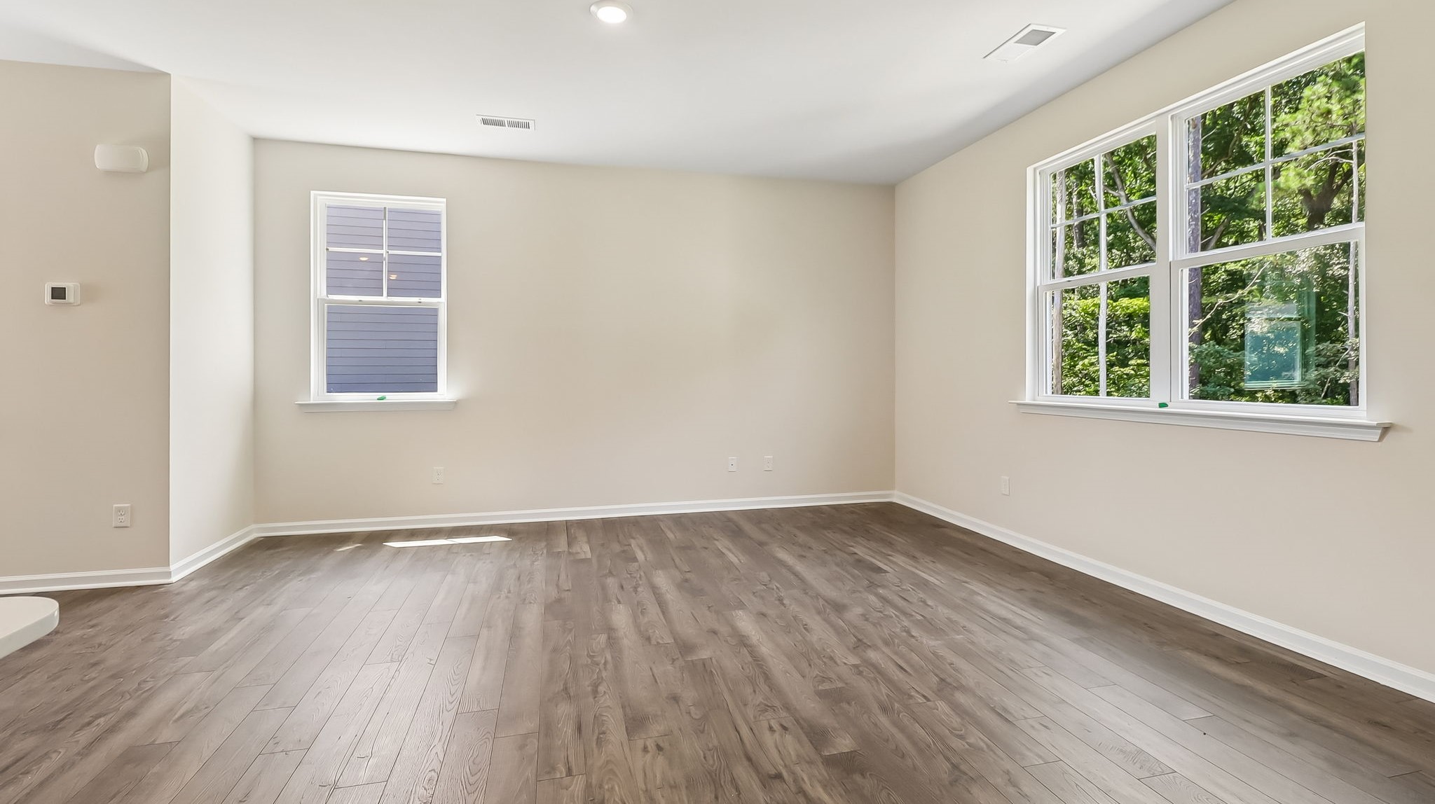 Living area with natural light in new construction home for sale in Sease's Pond