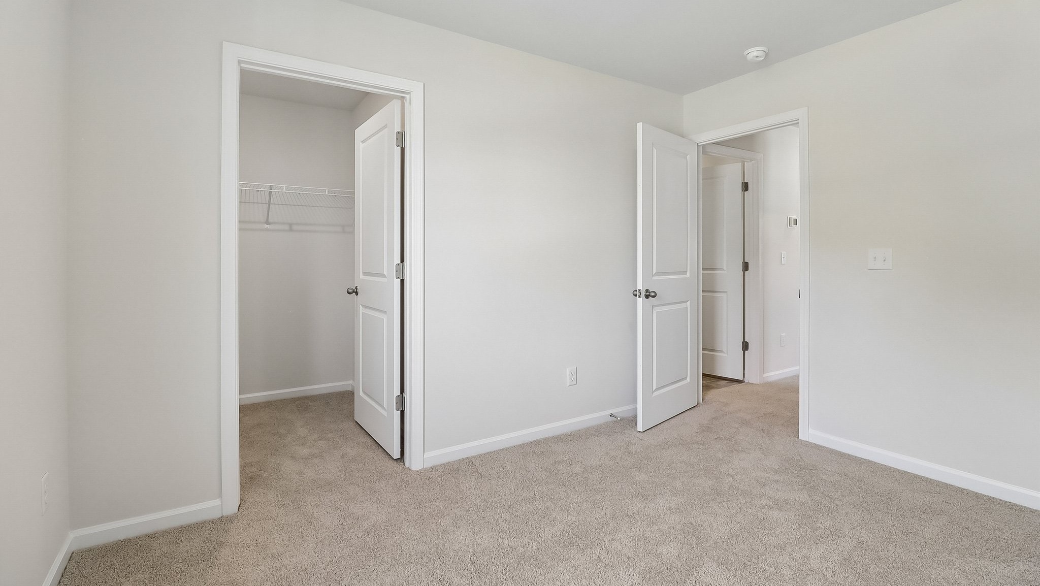 Walk-in closet in bedroom 4 of two-story home for sale in Sease's Pond