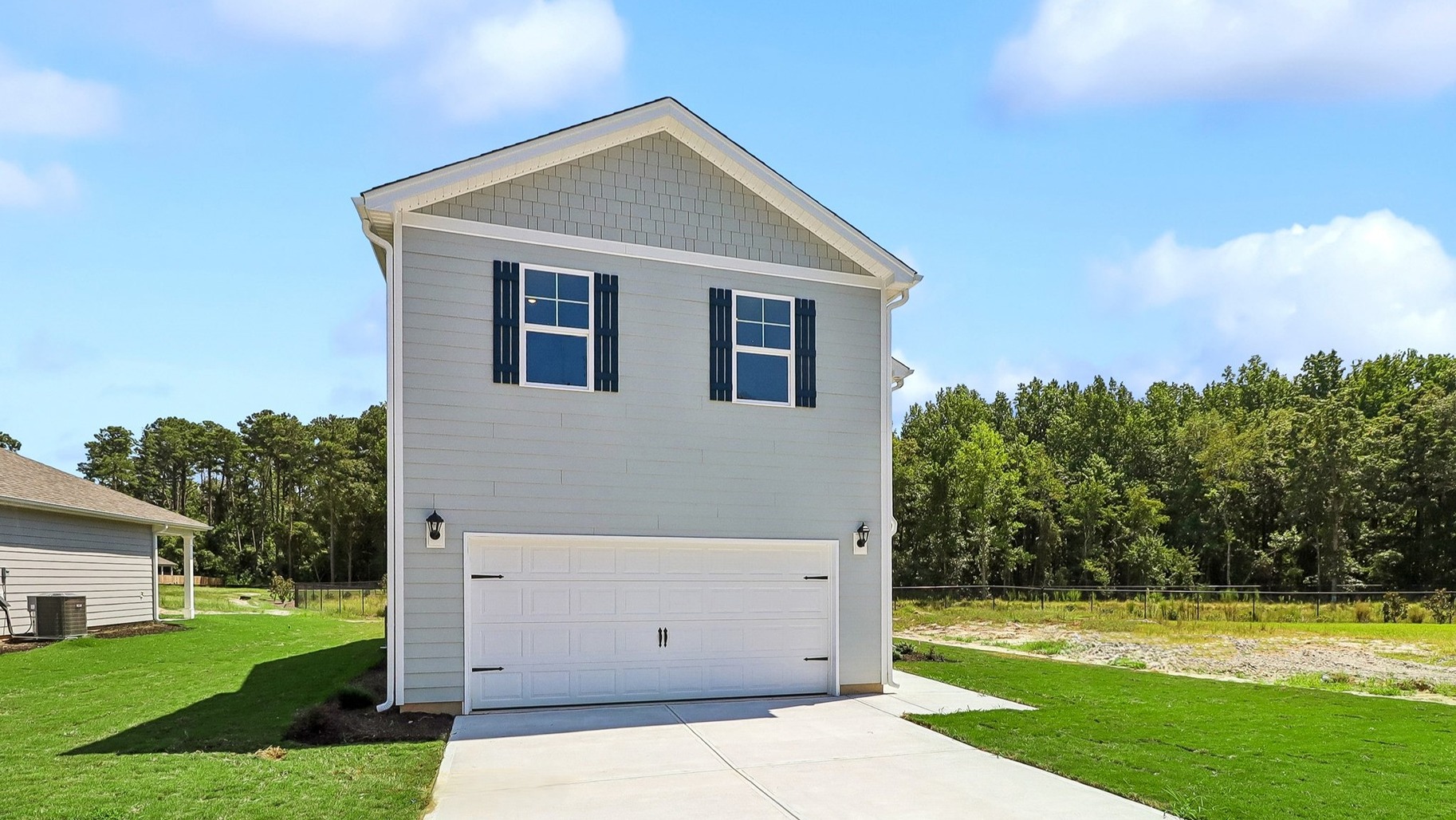 Back at the front of the home with a spacious driveway for parking