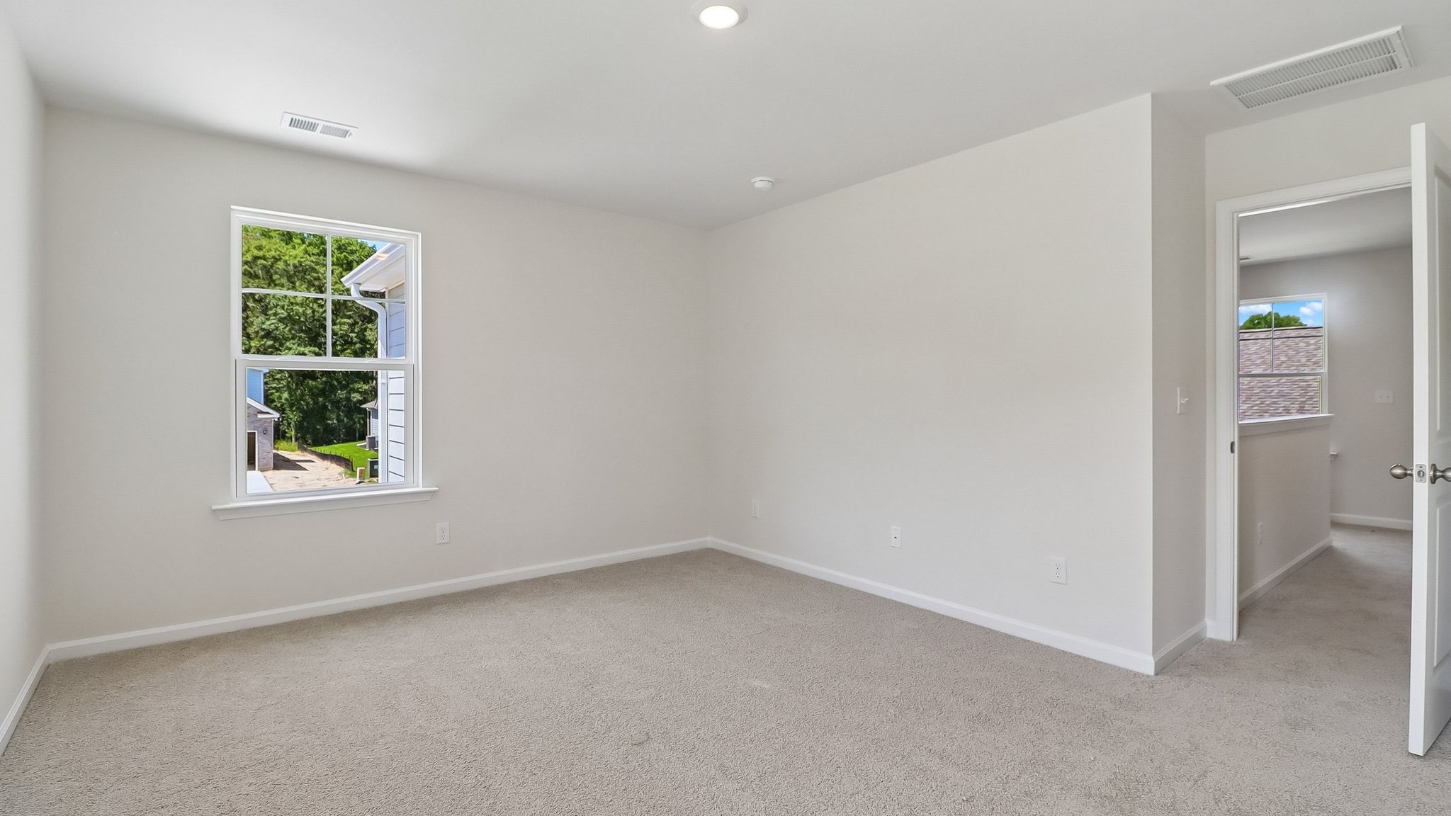 Windows for natural light in the primary suite