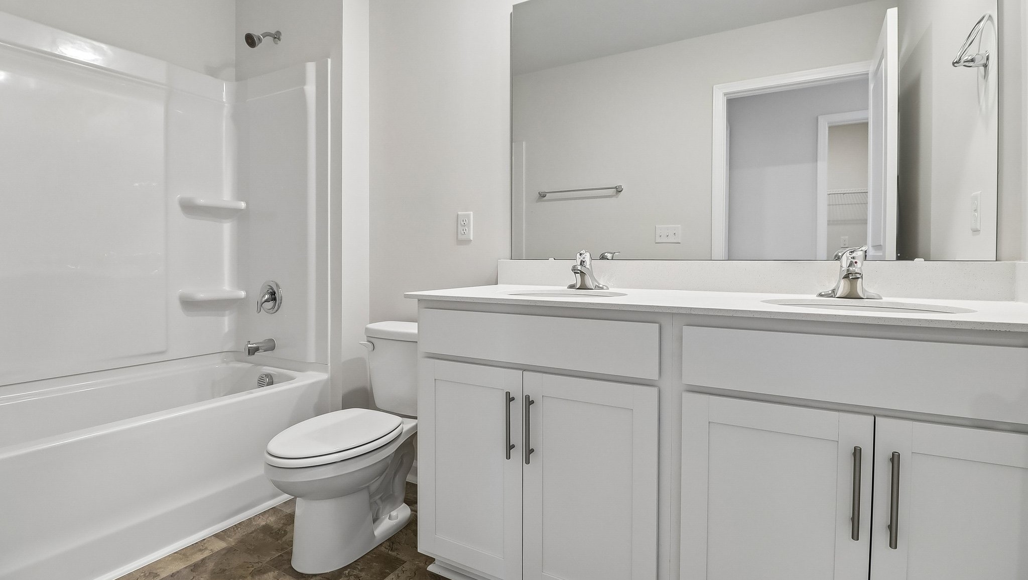 Bathroom 2 with a double vanity and a shower tub combo