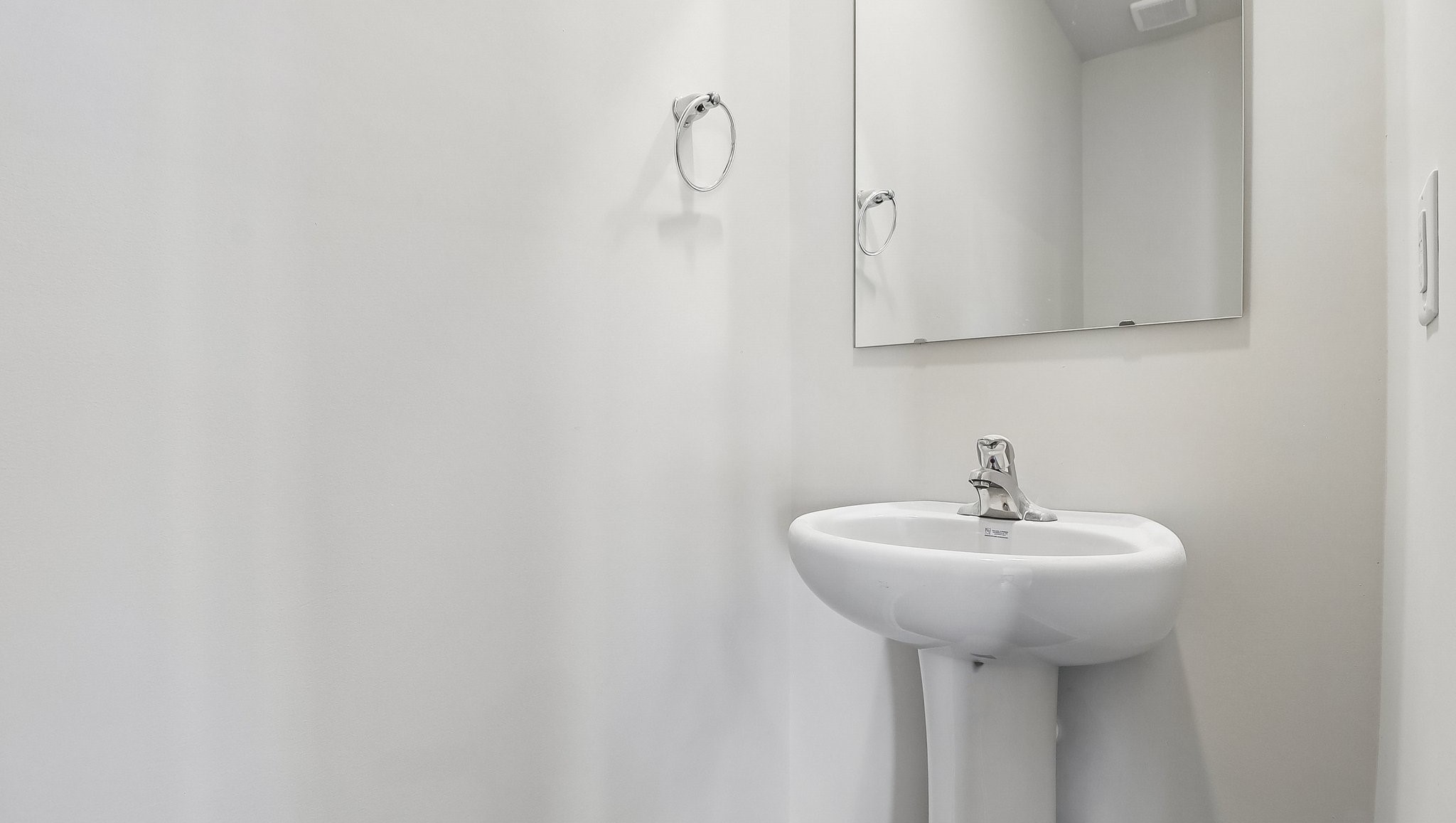 Convient first-floor powder room in the Aisle floorplan for sale in Sease's Pond