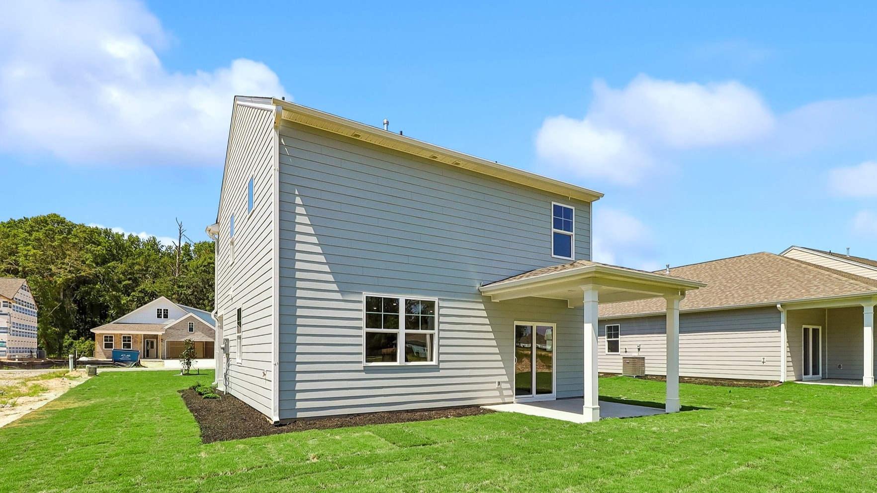 Back exterior of the home with a covered back patio