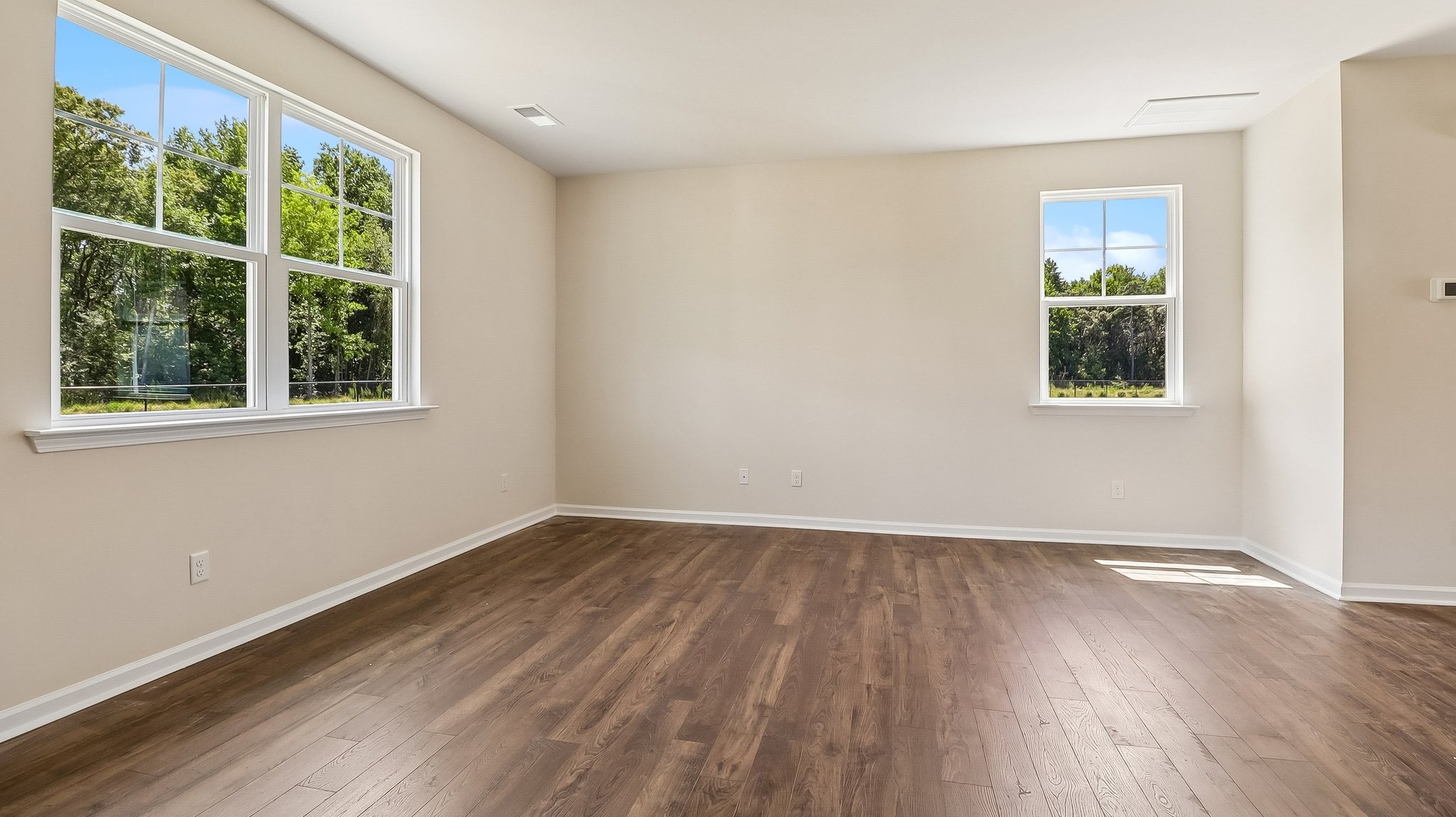 Natural light floods the open living areas of new construction home for sale in Sease's Pond in Gilbert, SC