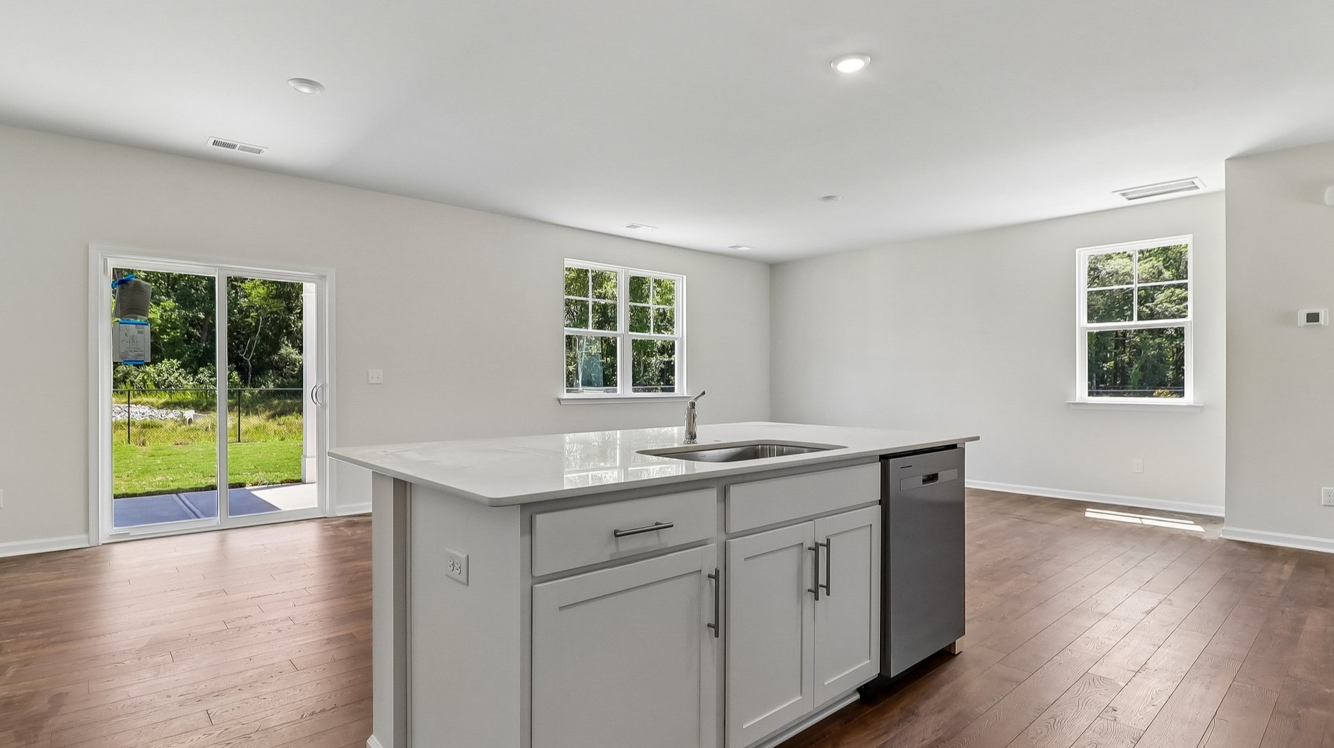 Floating kitchen island in home for sale in Sease's Pond with a dishwasher and kitchen sink
