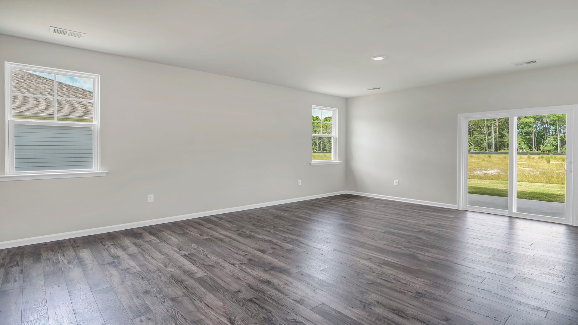 Access to the covered back patio through glass sliding doors in the Manning living area
