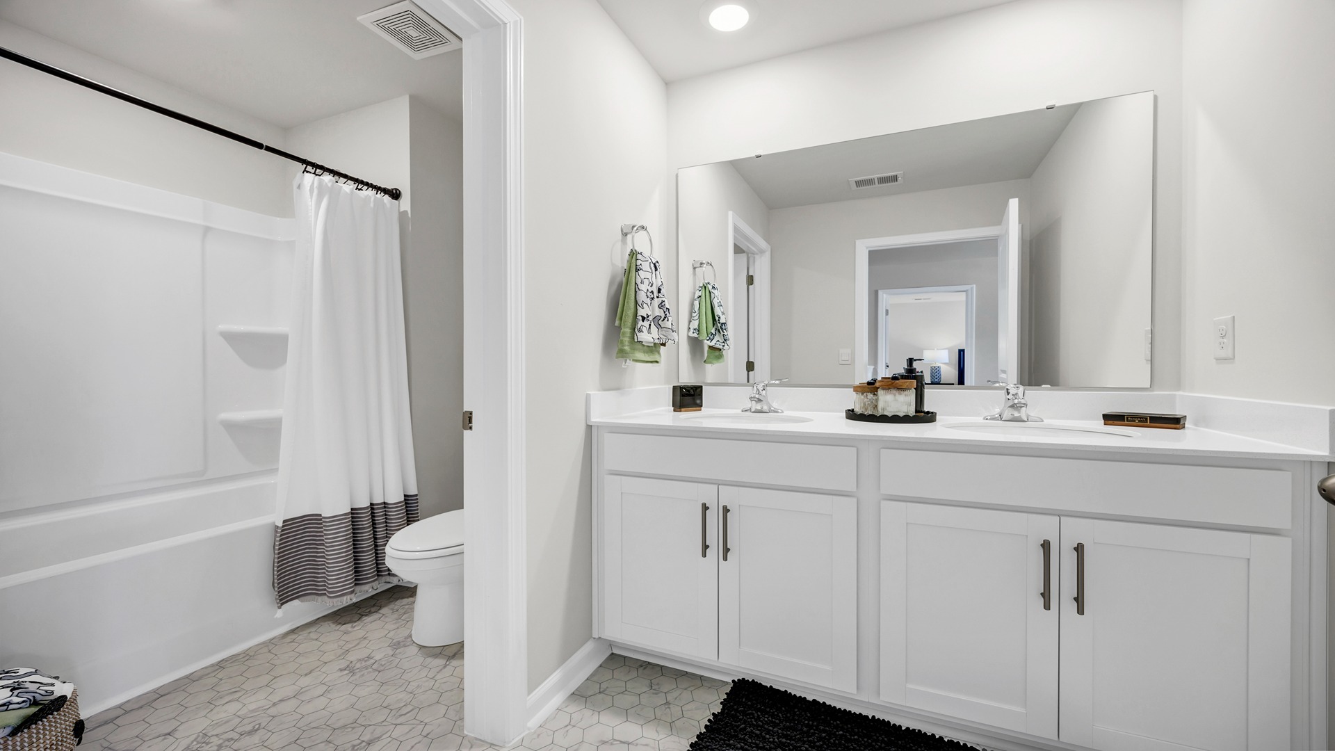 Bathroom 2 upstairs with a private water closet and a bathroom vanity with 2 sinks
