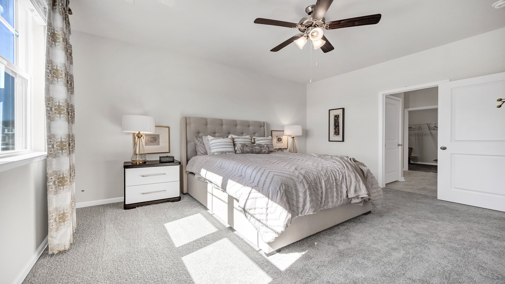 Primary bedroom has direct access to en-suite walk-in closet and bathroom