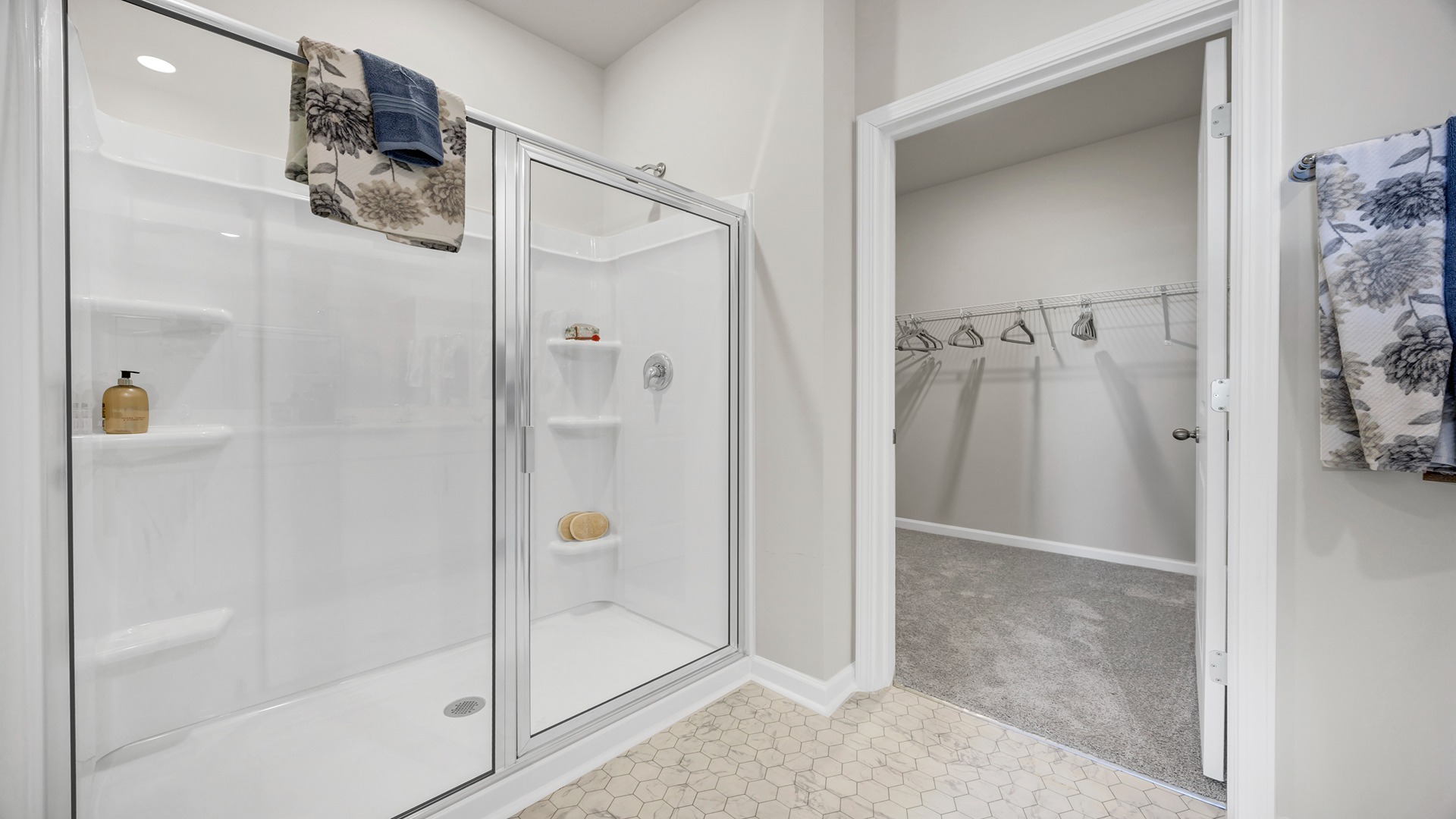 Walk-in, glass front primary shower in the primary bathroom
