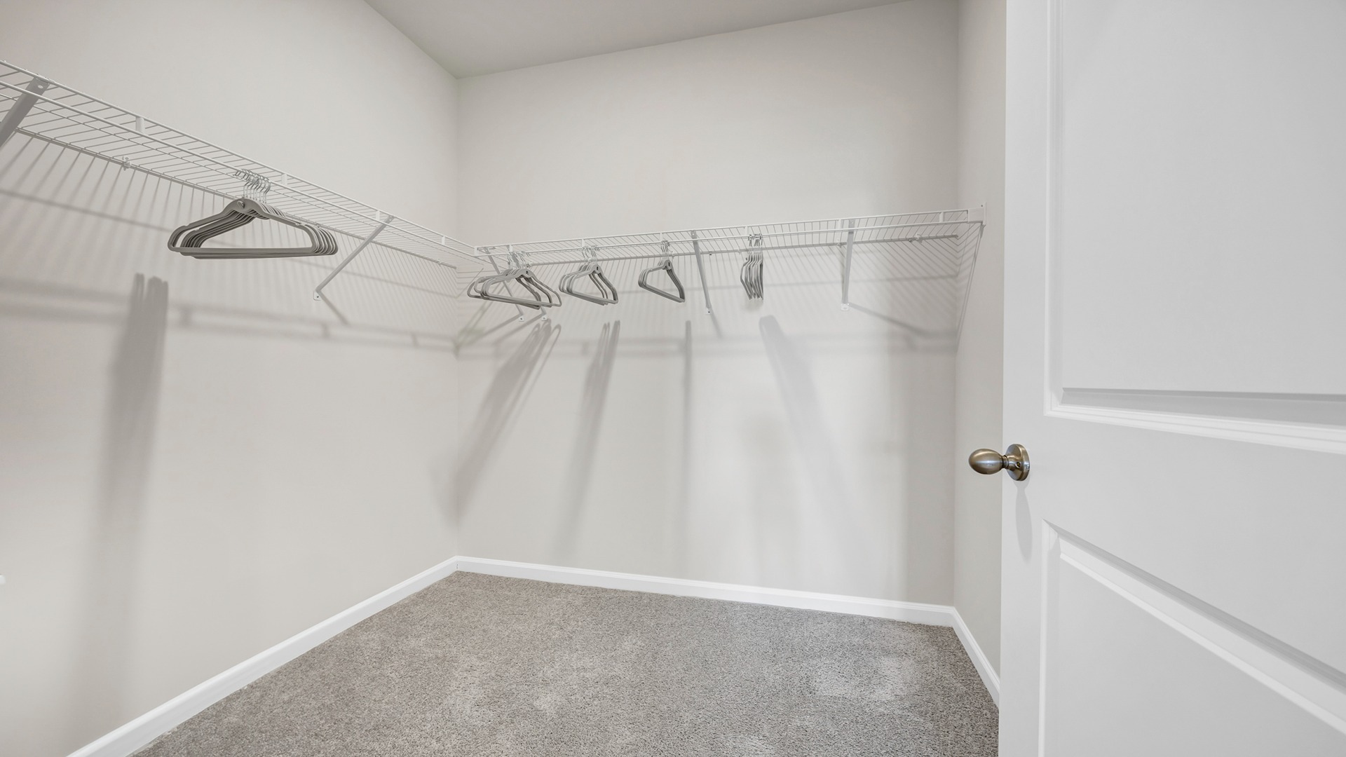 Walk-in primary closet in the Manning primary suite