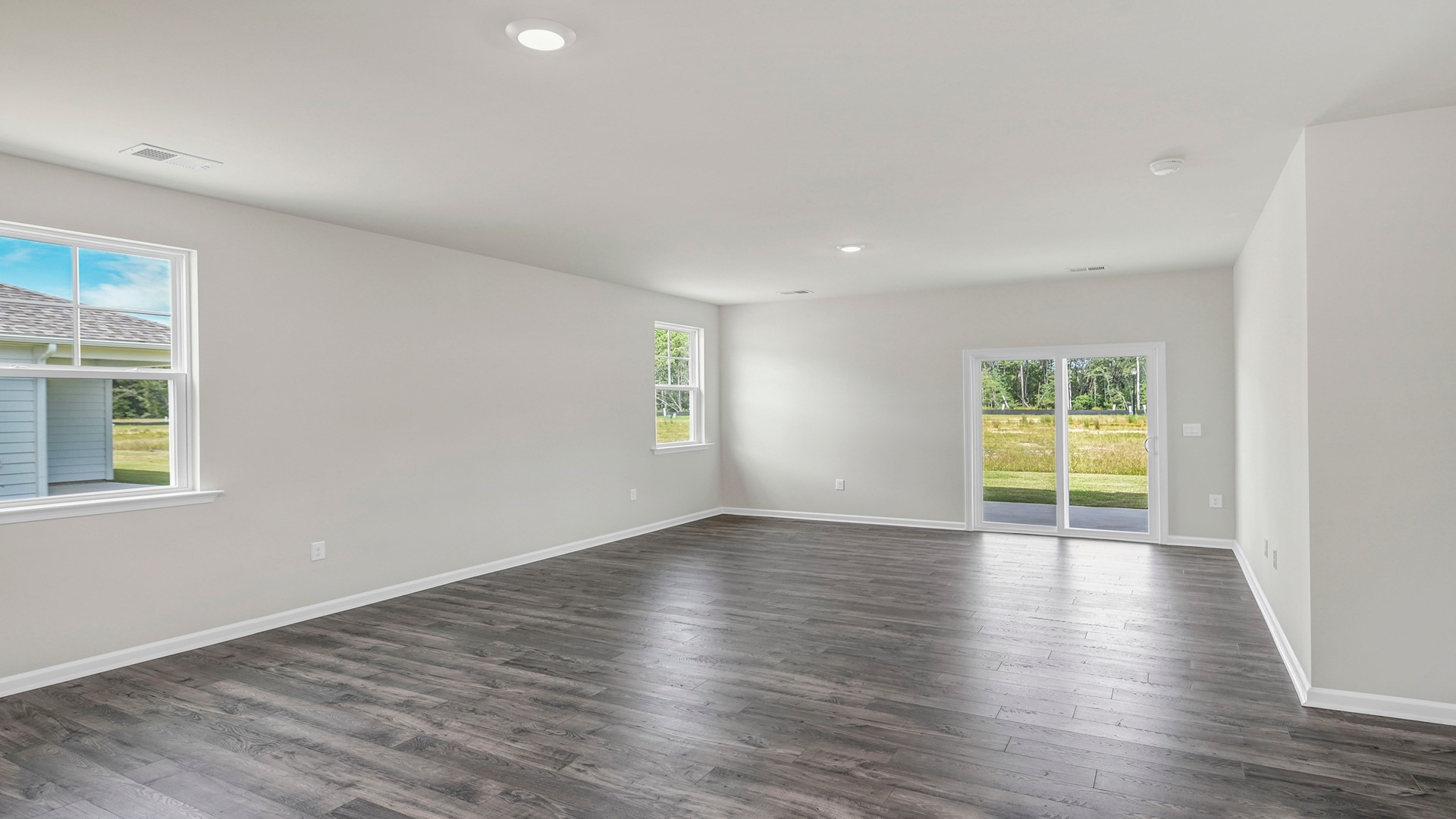 The dining and living areas are open concept finishes with Revwood flooring