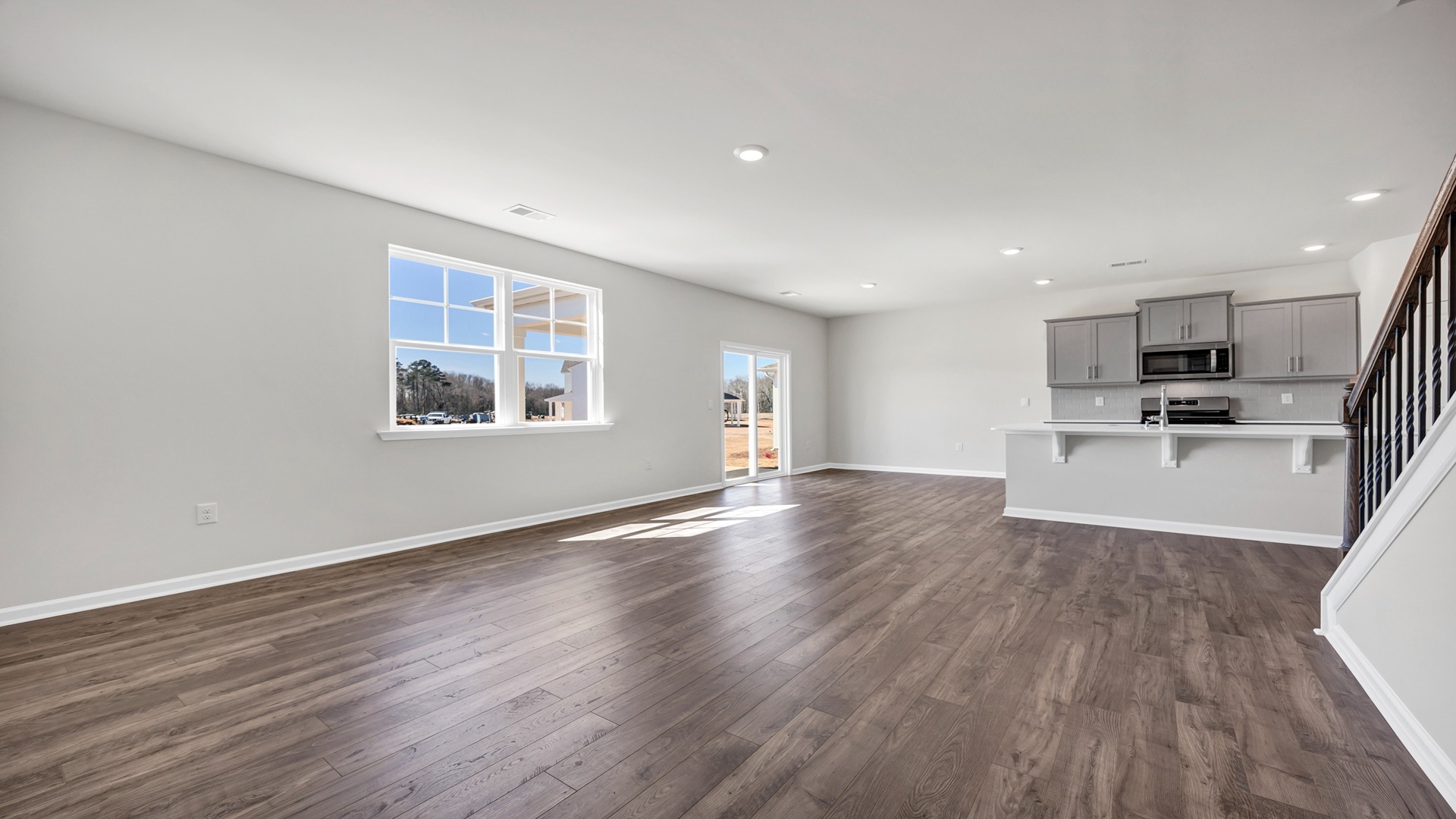 Open concept dining, kitchen, and living areas