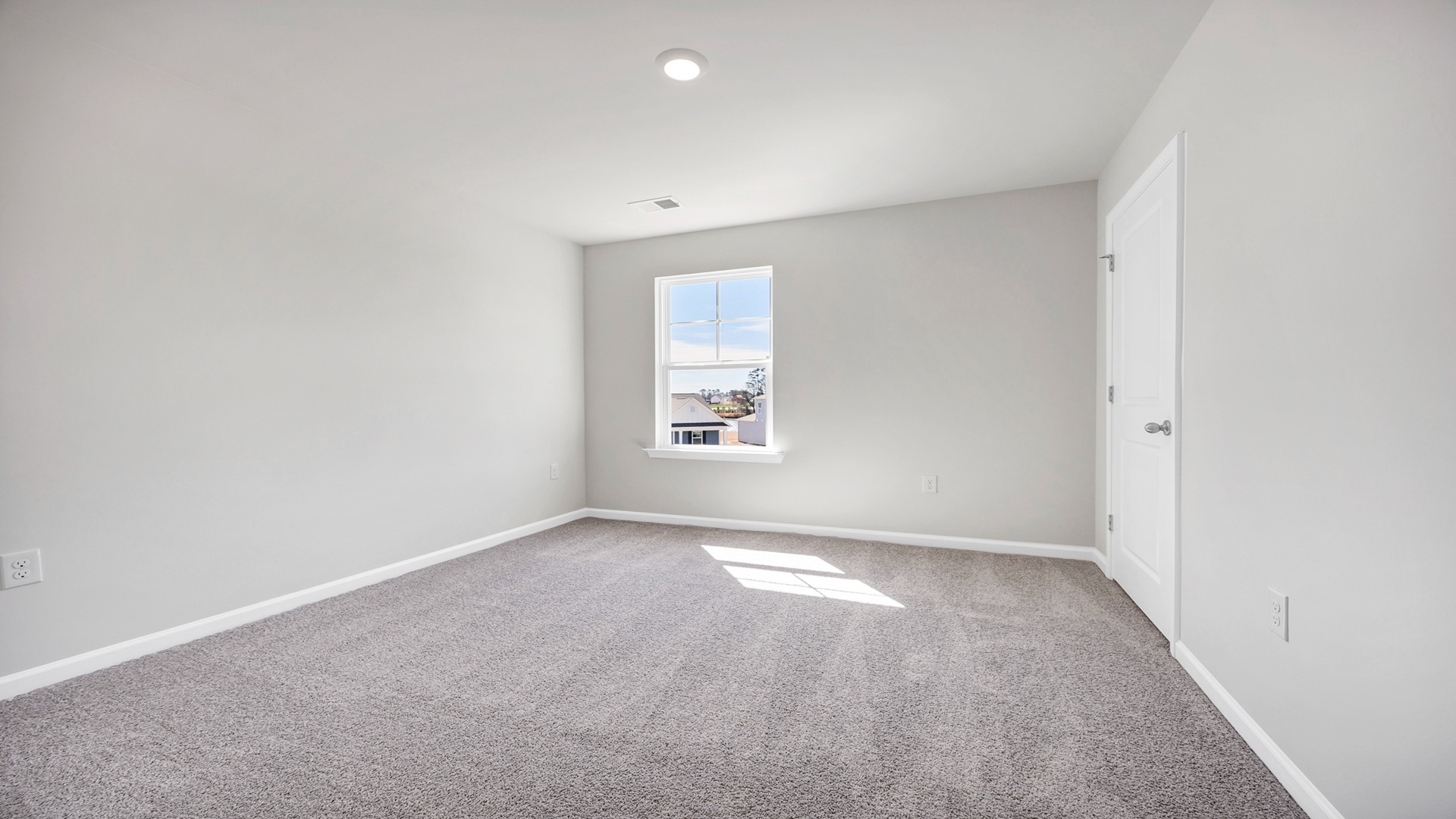 Bedroom 5 upstairs with carpet flooring and a window