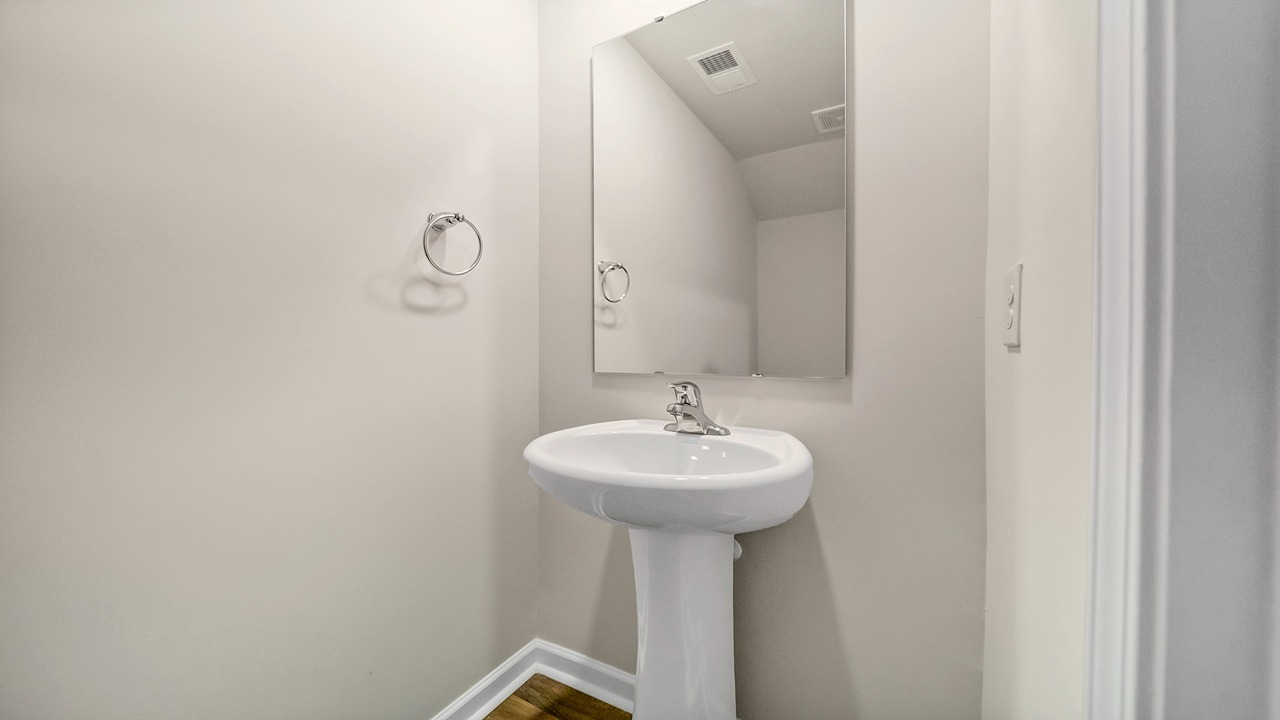 There is a powder room on the first floor off the front foyer.