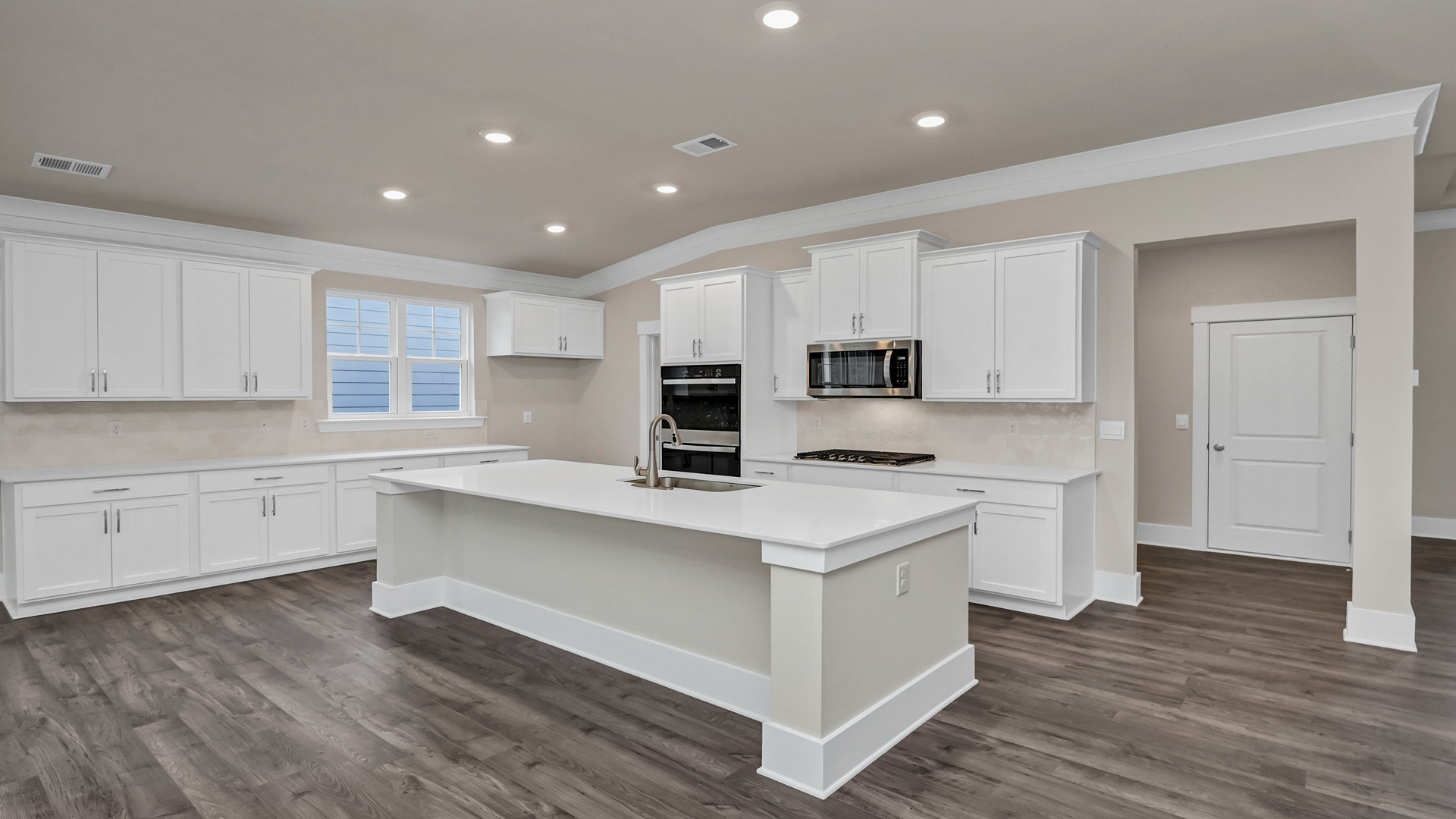 Kitchen and adjacent hallway for laundry room access