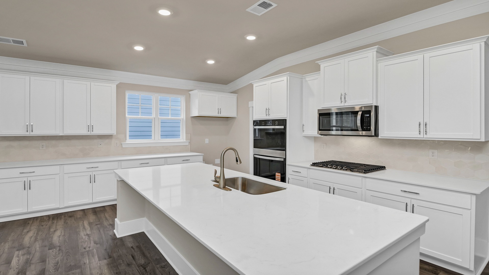 Eaton kitchen in Chapin, SC with sleek, modern white quartz countertops
