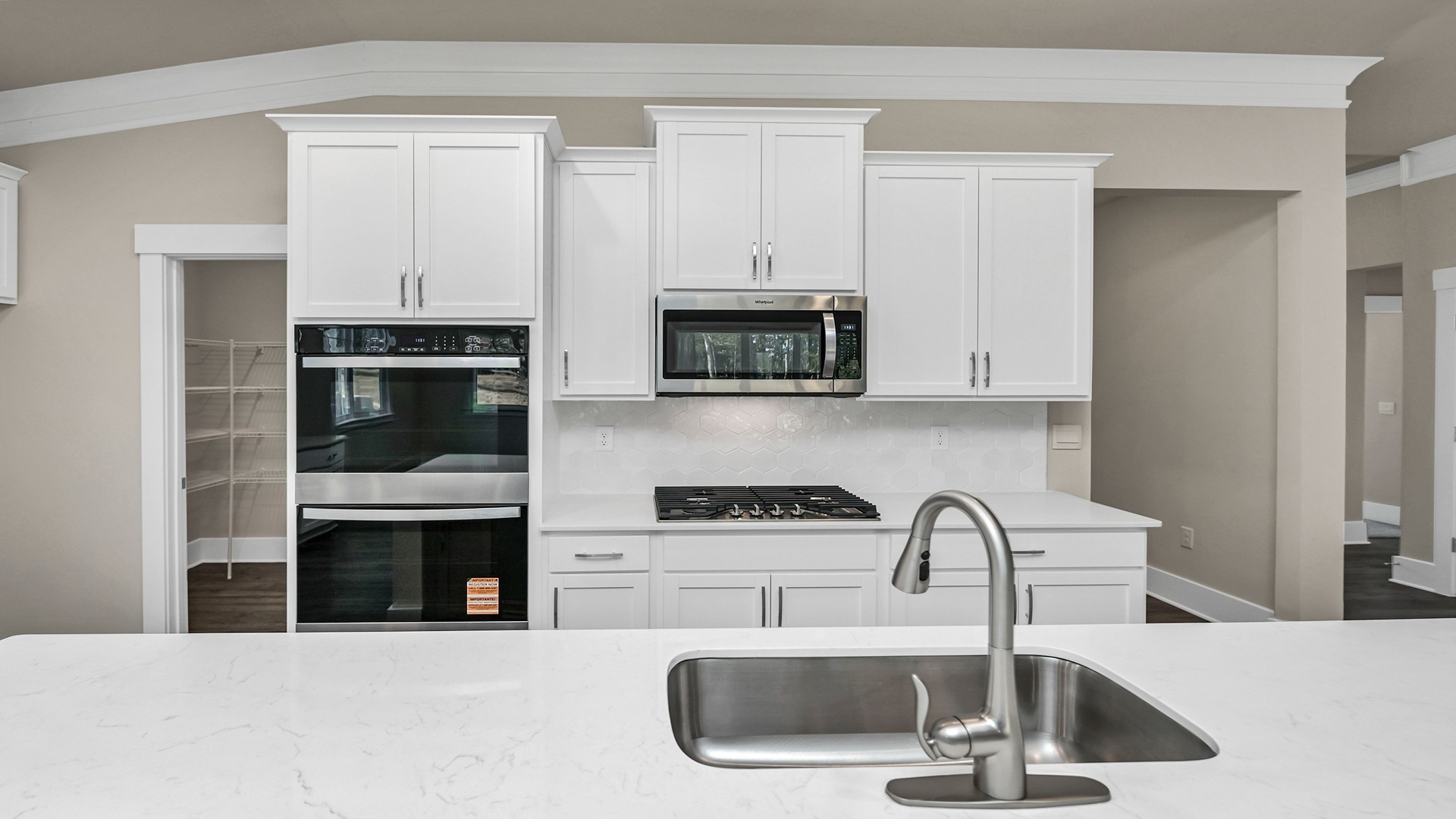 Double wall ovens and stainless-steel kitchen appliances in the kitchen
