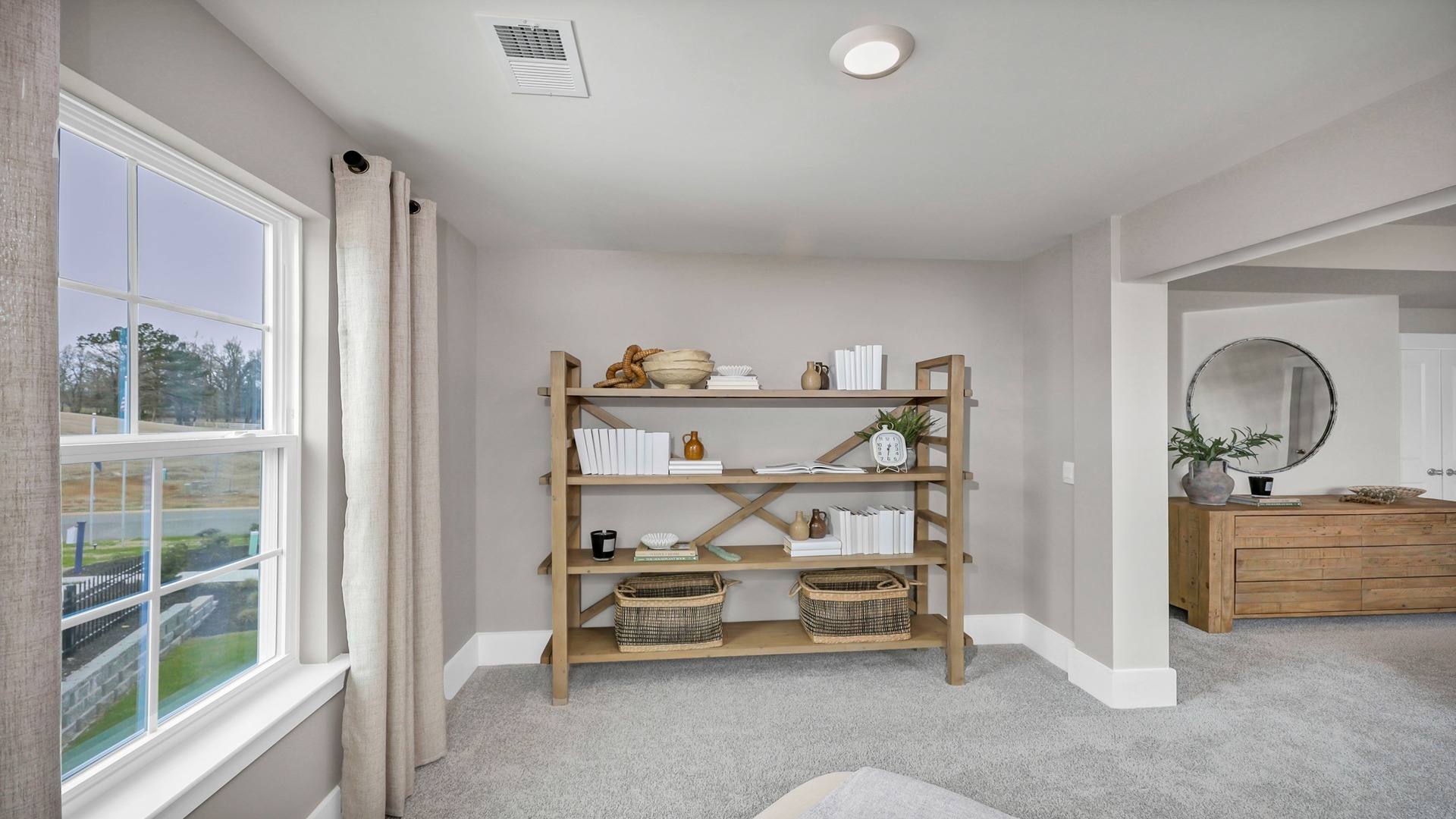 Sitting room with windows in primary suite
