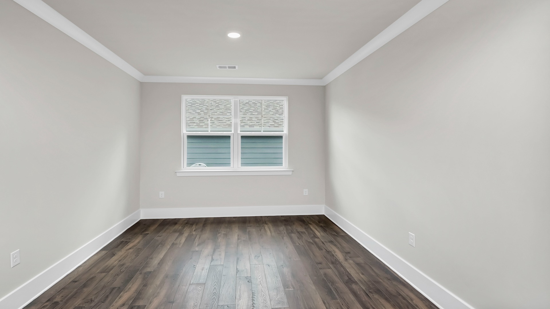 Flex space with RevWood flooring and a window for light
