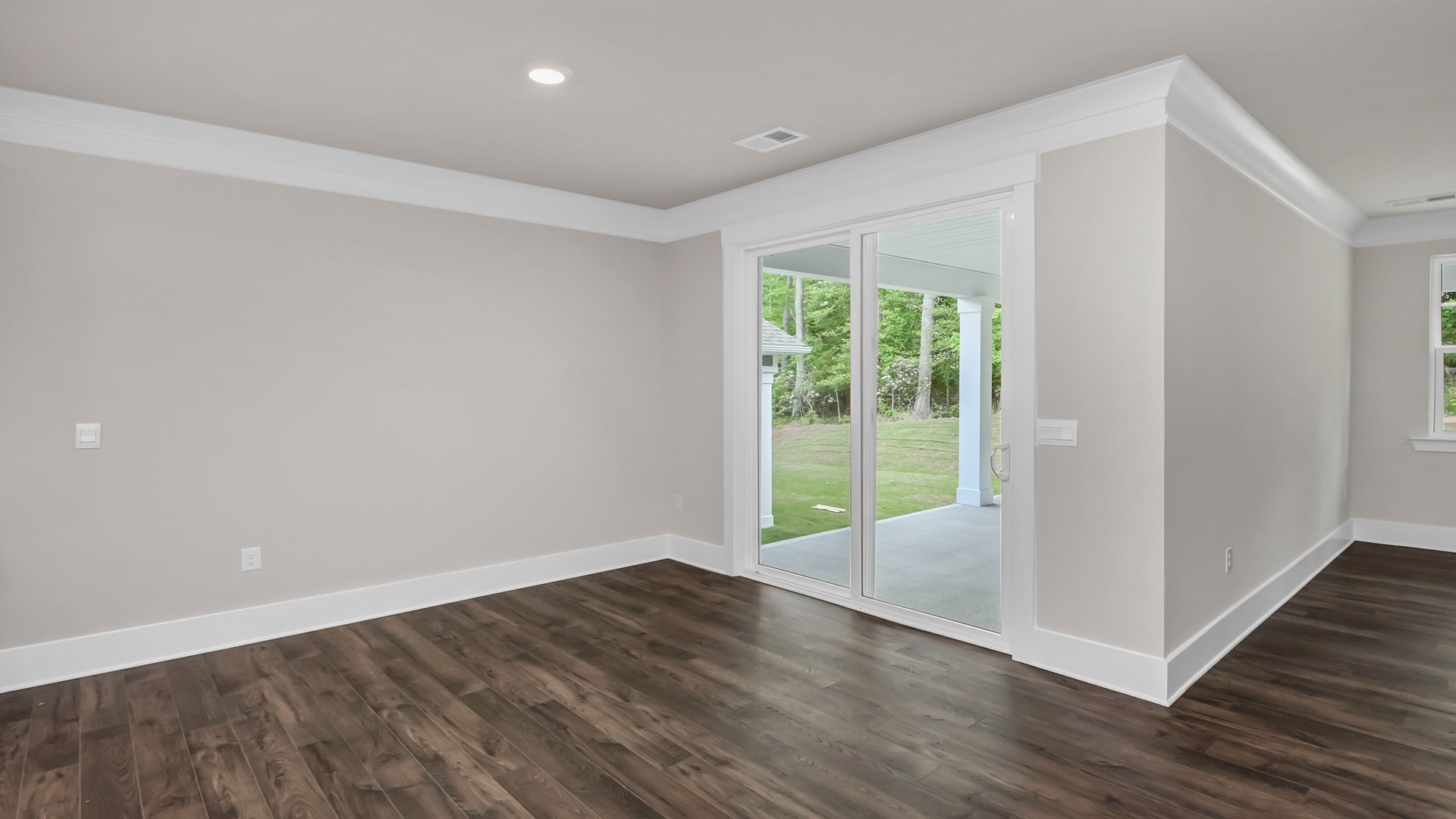 Access to back patio from the dining area through glass sliding doors