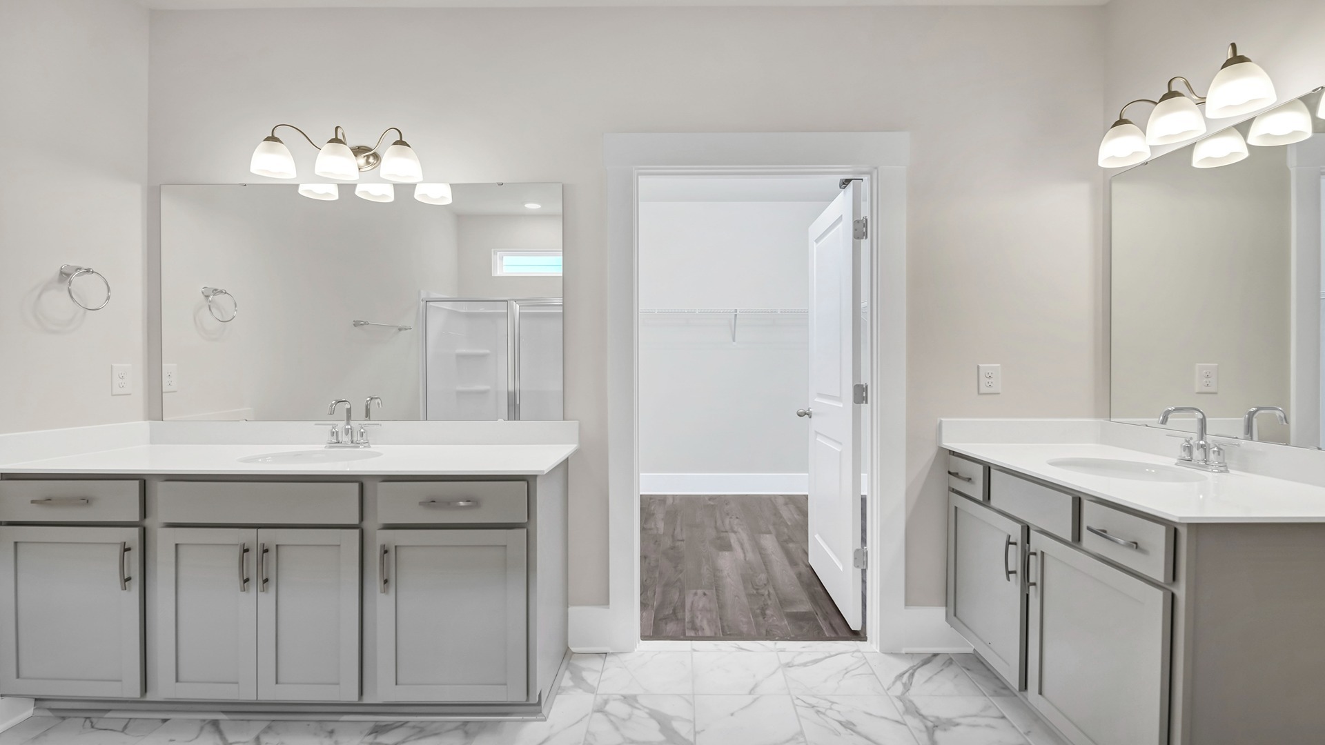 En-suite primary bathroom with two vanities