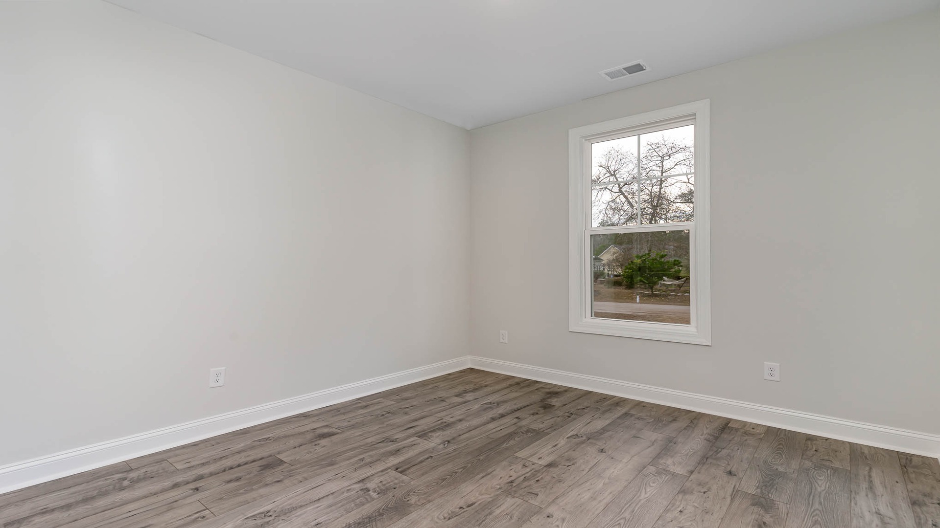 Front bedroom 2 in ranch-style home with 3-car garage in Chapin, SC