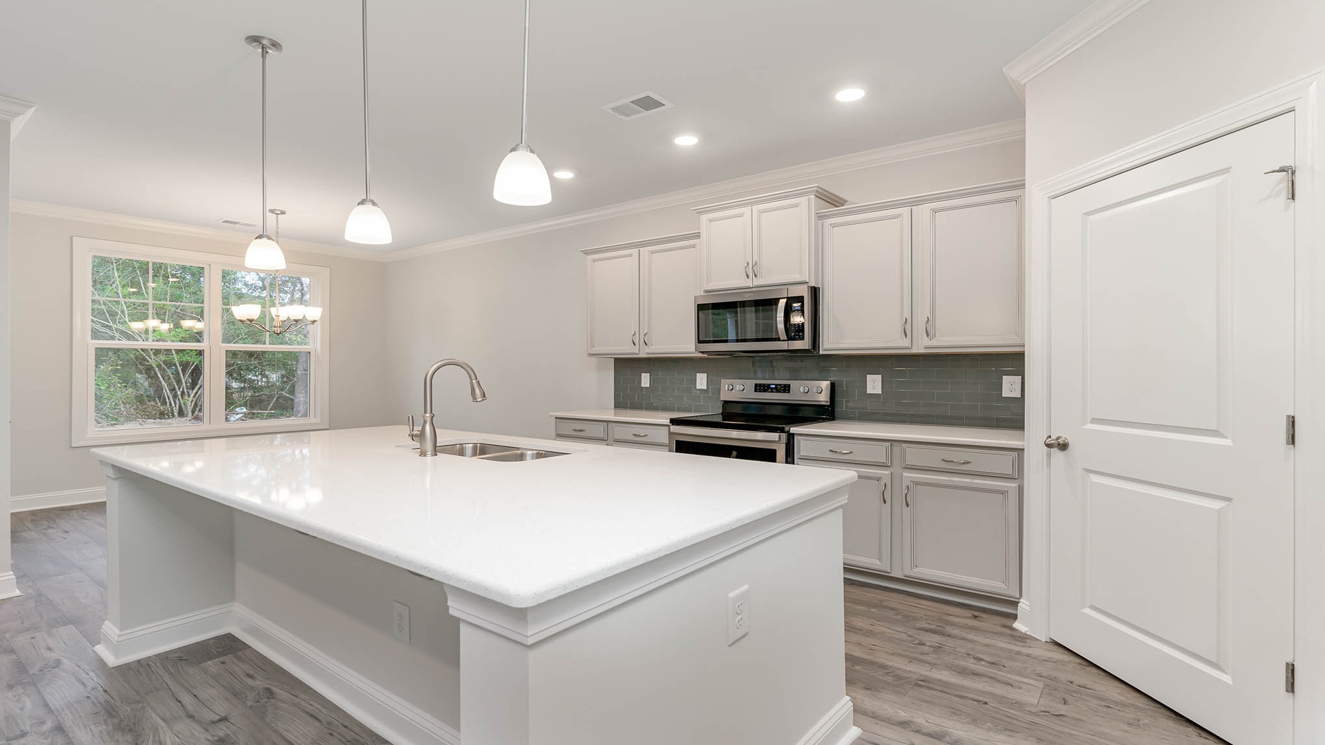 Modern kitchen in new construction home in Chapin with quartz countertops