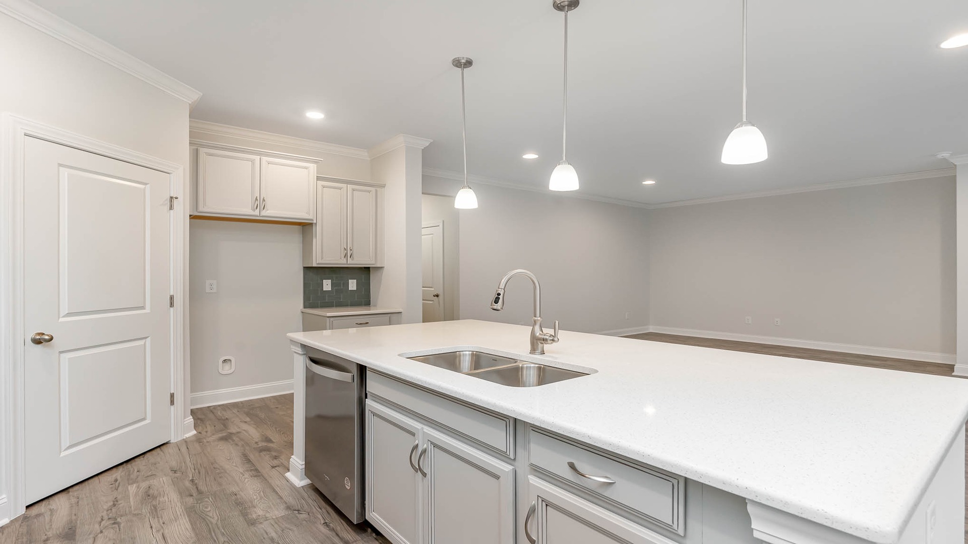 Floating kitchen island overlooks the open living space in the Madison in Lake Tide Summit