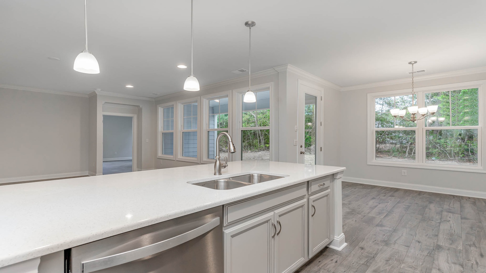 Kitchen island overlooks the living and dining areas in the Madison floorplan