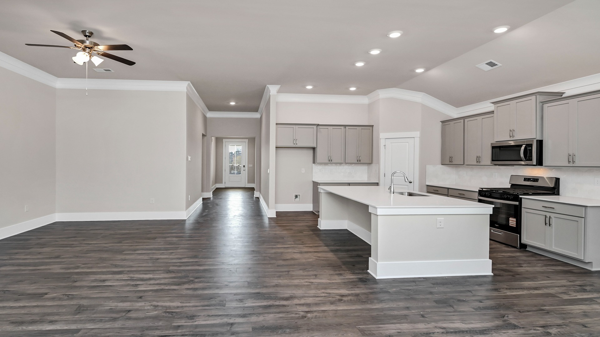 The front foyer opens up into the living and kitchen areas