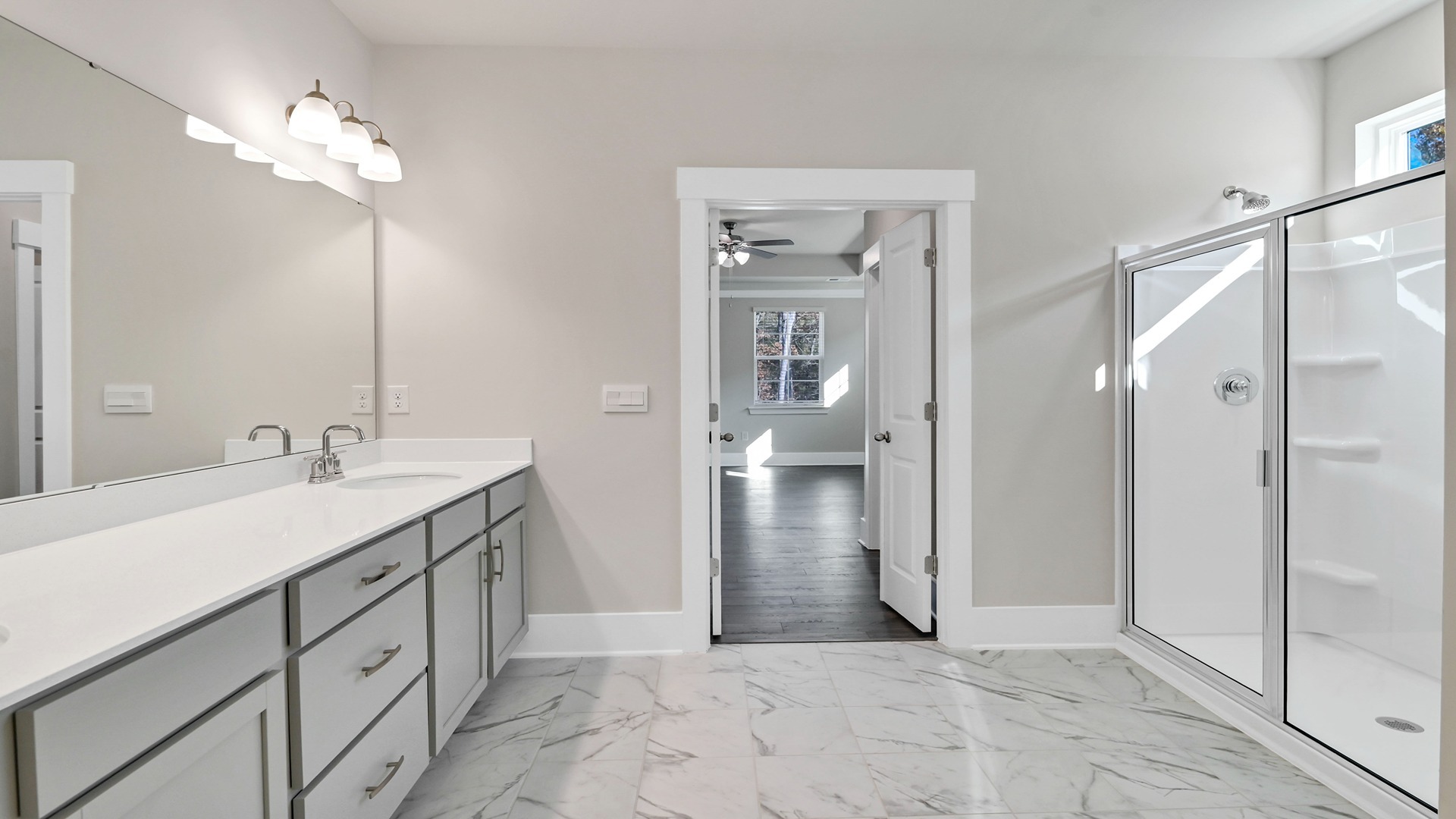 Primary bathroom with tile flooring