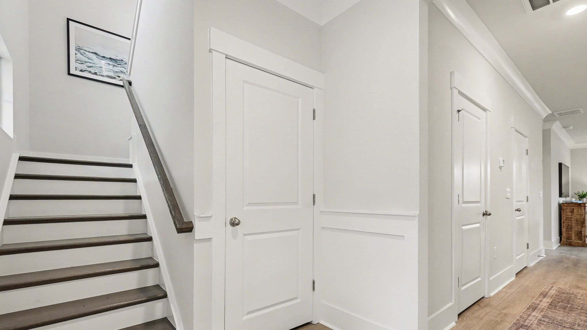 Oak tread stairs and several closets for storage