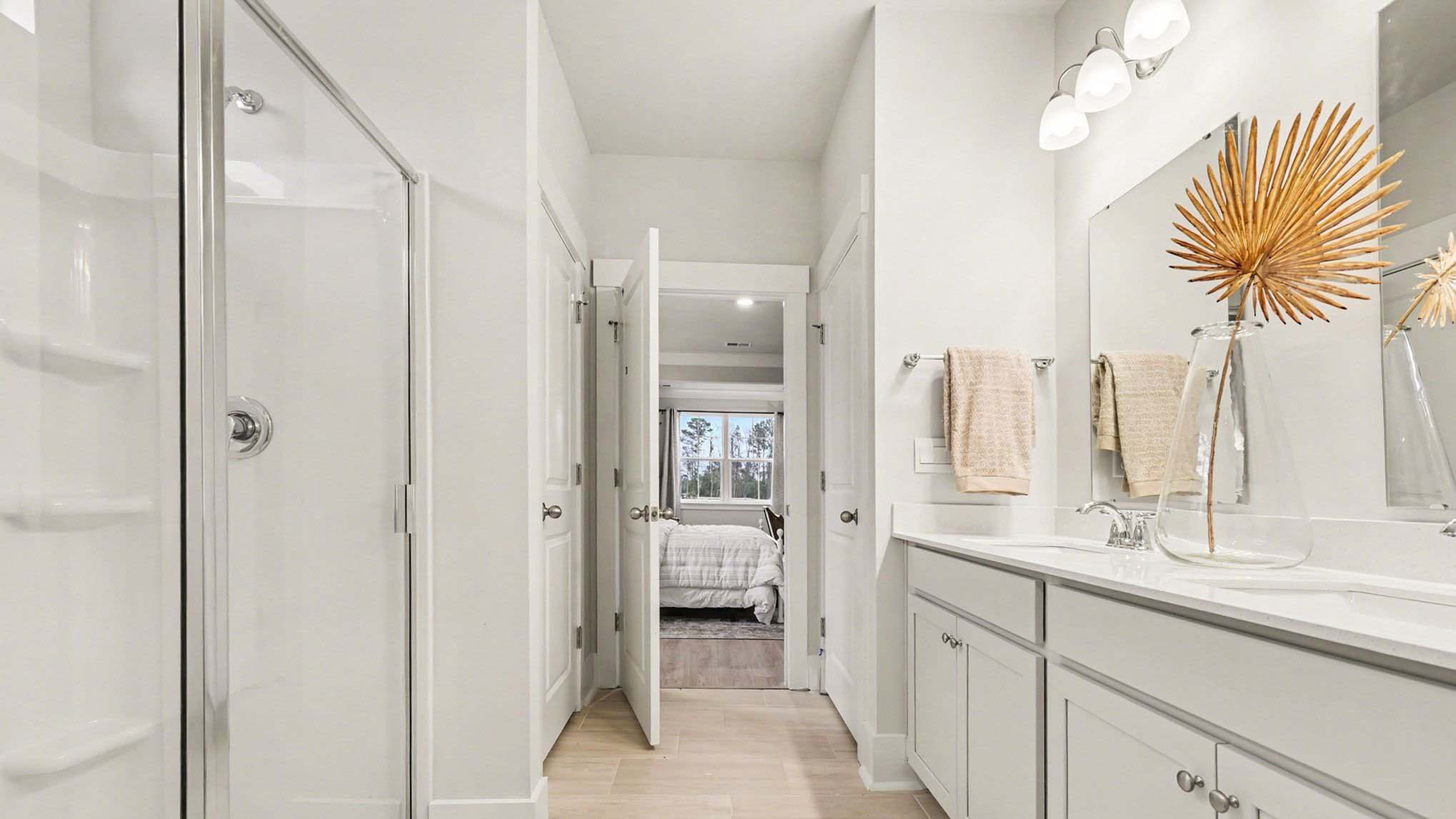 En-suite primary bathroom with a standup shower and a double vanity