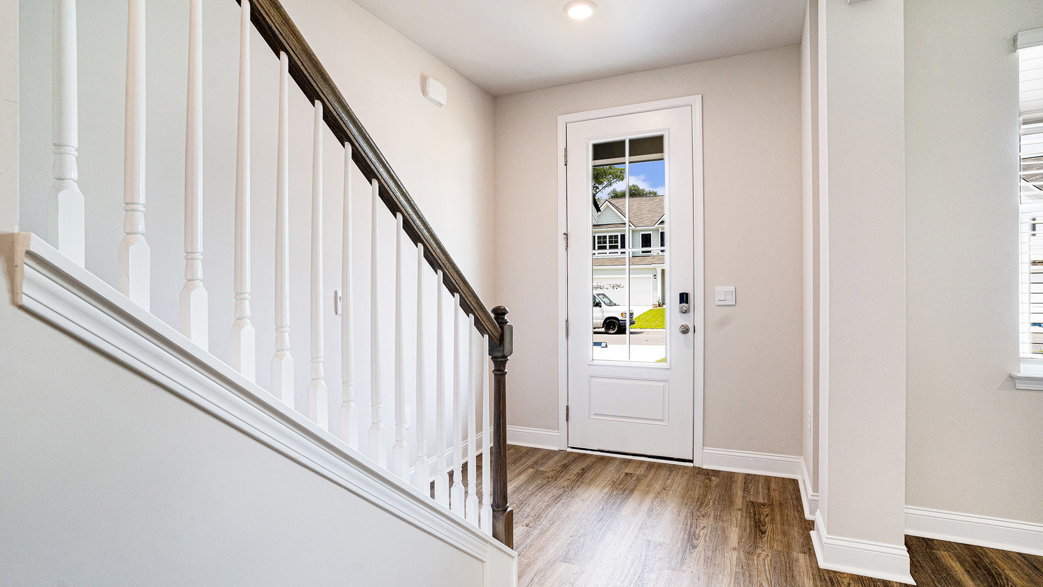 Front door welcomes you into the naturally lit front foyer