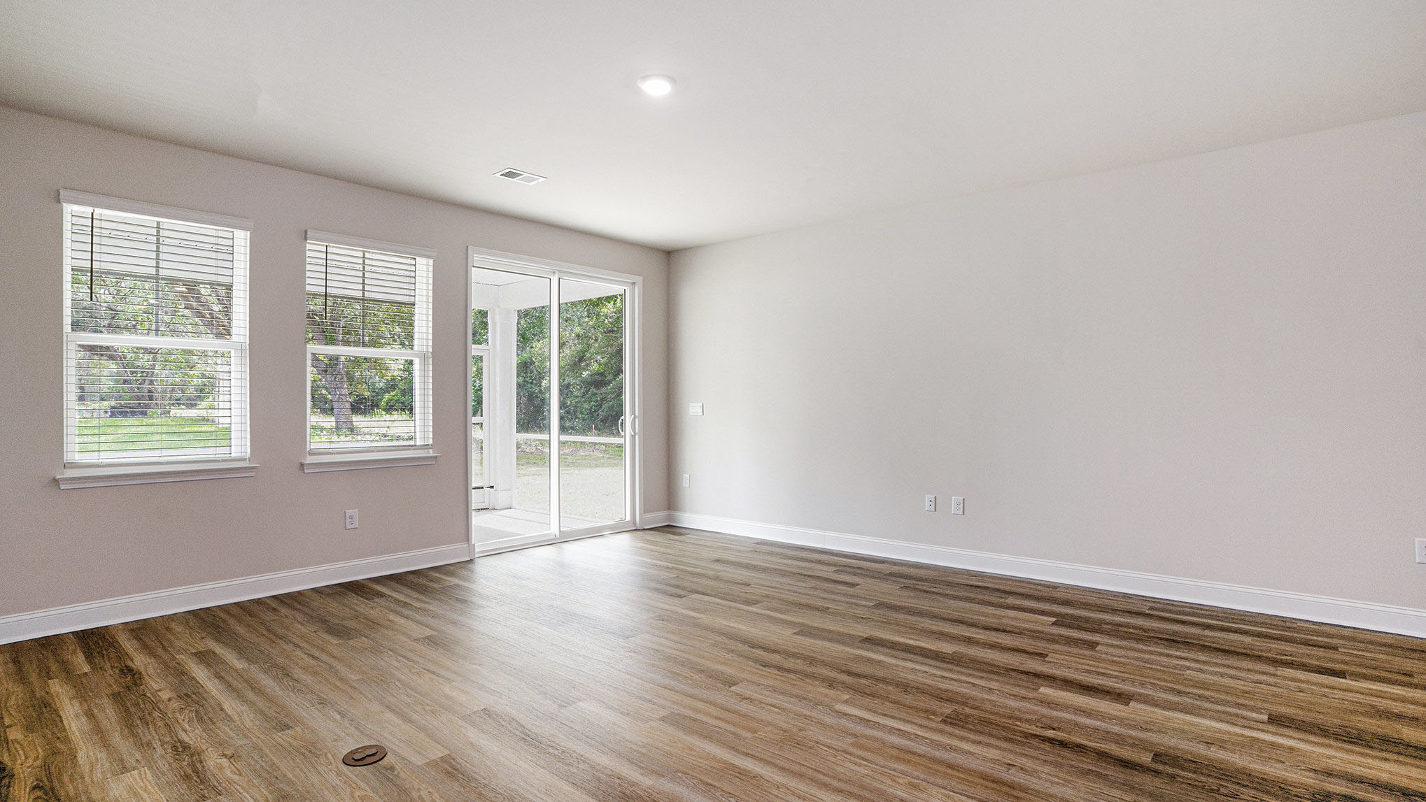 Living area with several windows to allow in natural light