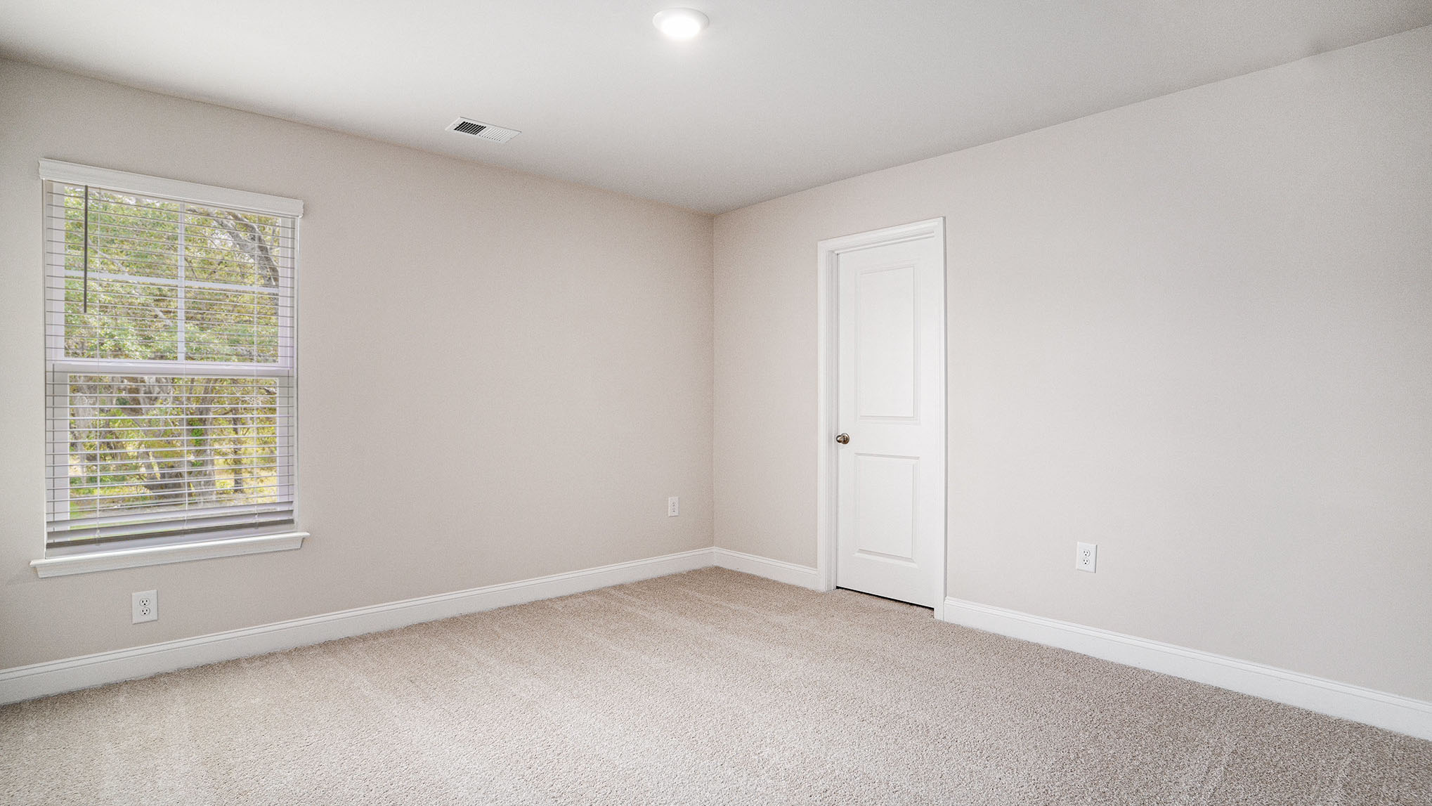 Bedroom 4 with carpet flooring and a window for light
