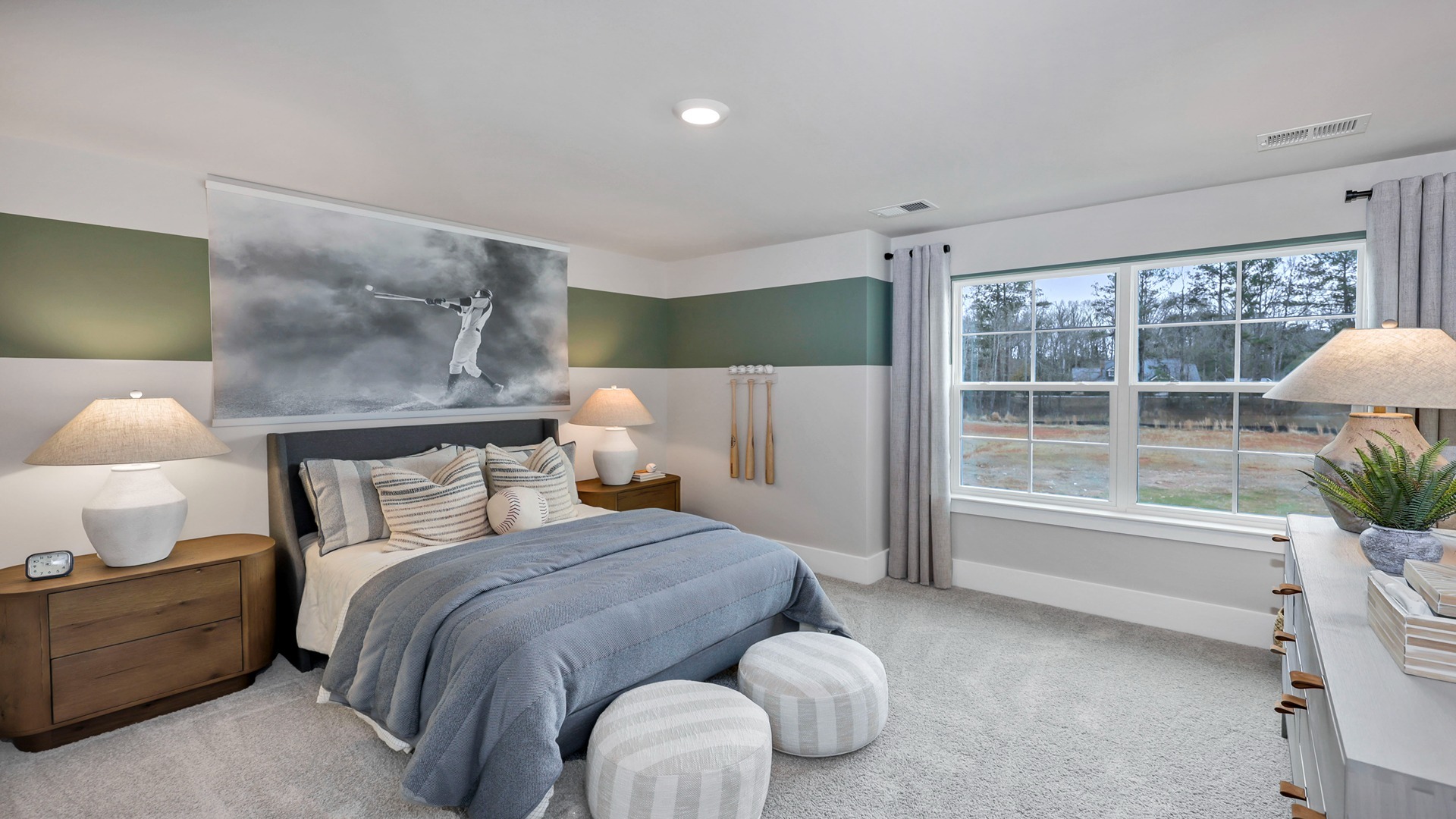 Bedroom 2 upstairs with a large window and carpet flooring