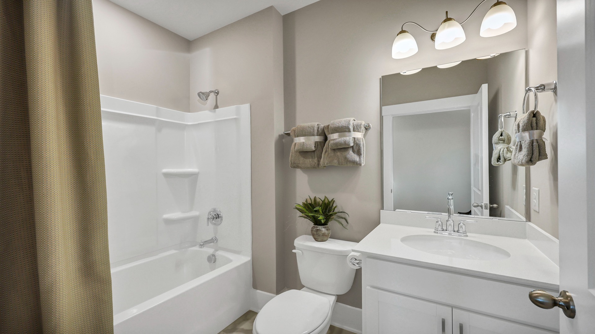 Bathroom 2 downstairs with shower tub combo and a single-sink vanity