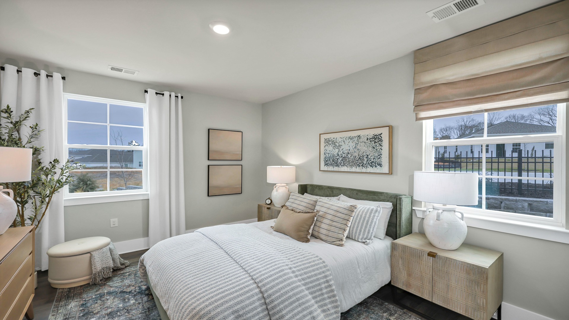 Downstairs bedroom with several windows for light