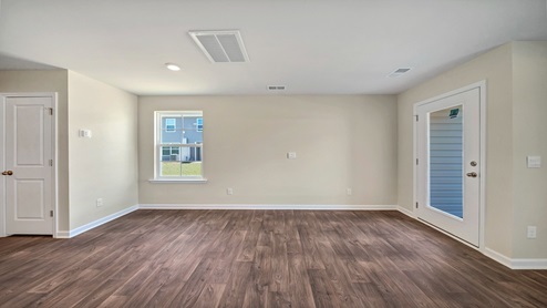 Spacious Pearson living/dining room, leading to back patio