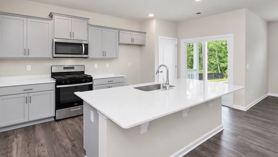 Natural light in the kitchen space from glass sliding doors leading to covered back patio and backyard in Gates Village