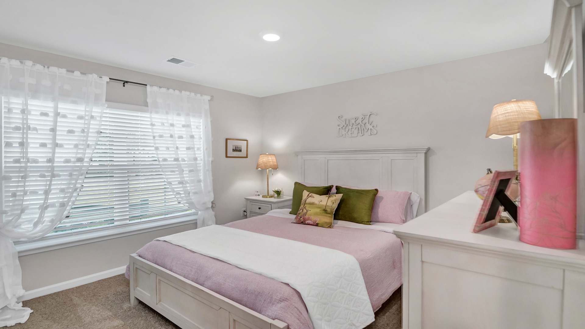 Bedroom 2 with carpet flooring and a window