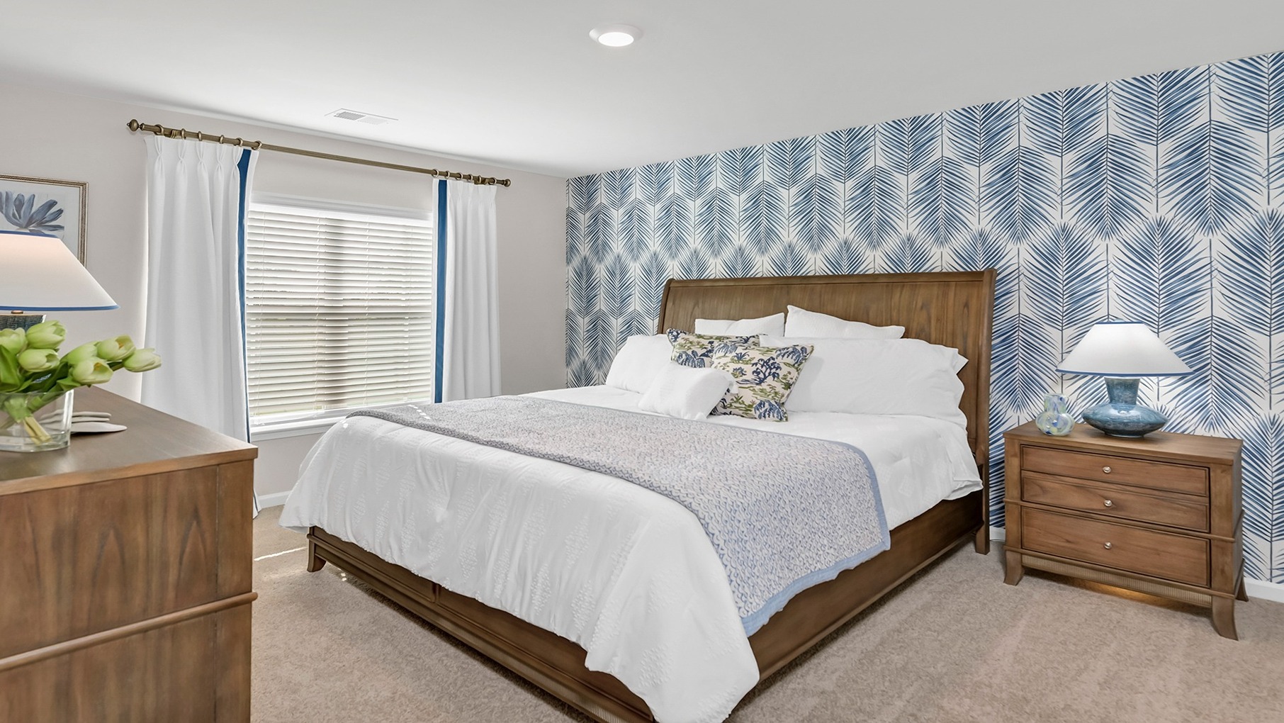 Primary bedroom tucked into the back of the home