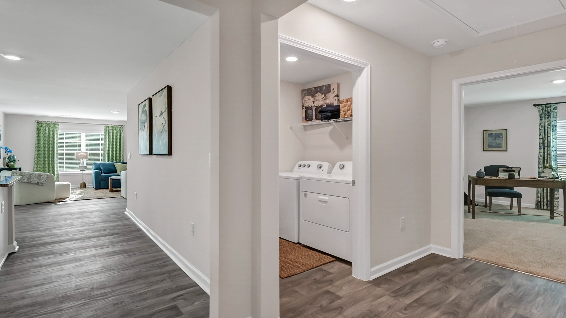 Hallway leading to laundry room and bedroom 4/den