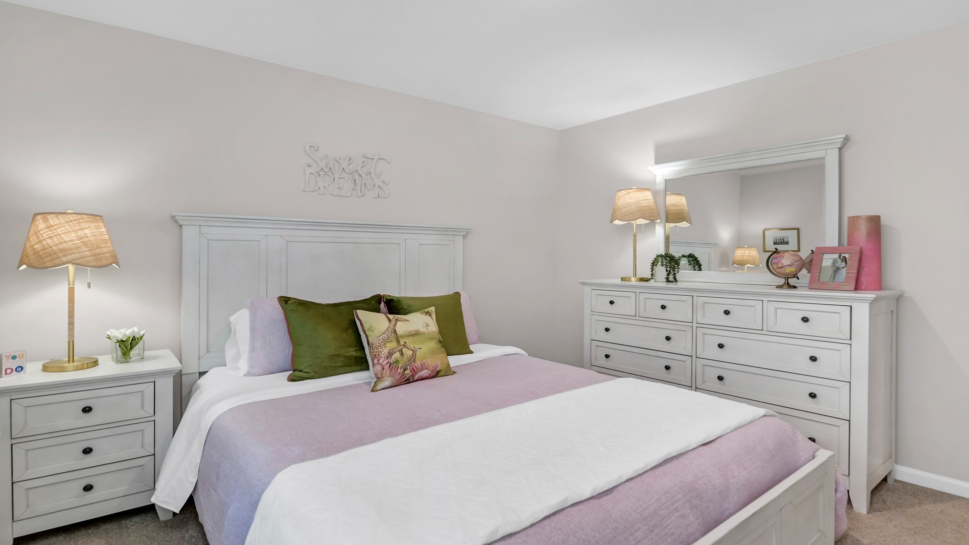 Bedroom 2 with carpet flooring and a front facing window