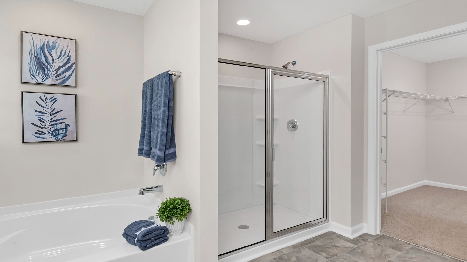 Walk-in closet within the primary bathroom